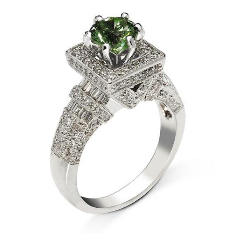 Forest is a beautiful green tsavorite ring created by Mike Nekta in NYC. 

Center Stone: Tsavorite Green

Carat Weight: 1.52

Shape: Radiant

Metal: 18K White Gold

Diamonds: F Color, VS, 0.82 ct total

Size: Can be adjusted to any size

Made in NYC