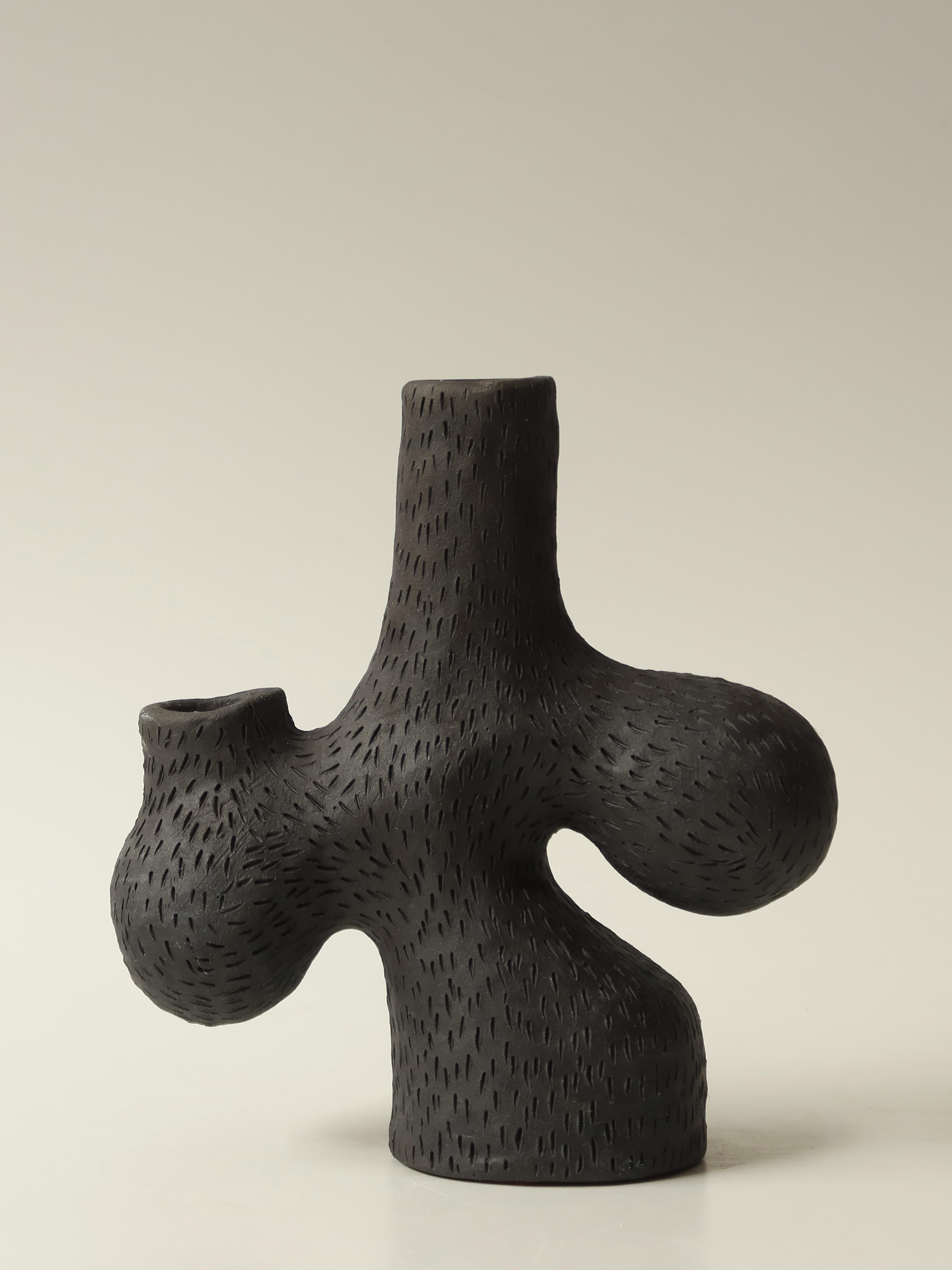 Forest candelabra no.1 by Jan Ernst
Dimensions: W 20 x D 80 x H 20 cm
Materials: White stoneware, Black clay, Terracotta

Glazed to client specification.


Jan Ernst’s work takes on an experimental approach, as he prefers making bespoke