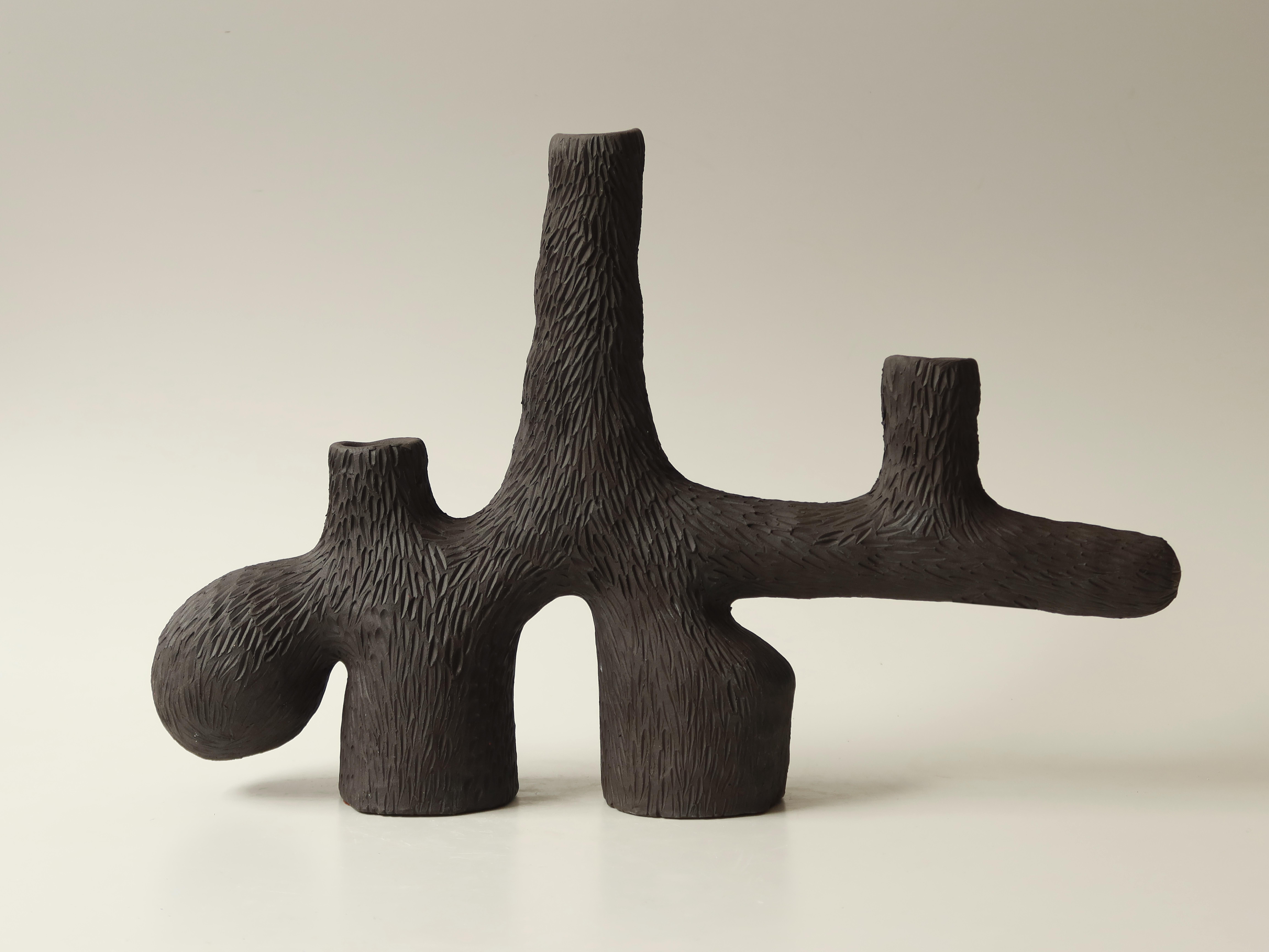 Forest candelabra no.2 by Jan Ernst.
Dimensions: W 30 x D 80 x H 28 cm.
Materials: white stoneware, black clay, terracotta.

Glazed to client specification.


Jan Ernst’s work takes on an experimental approach, as he prefers making bespoke
