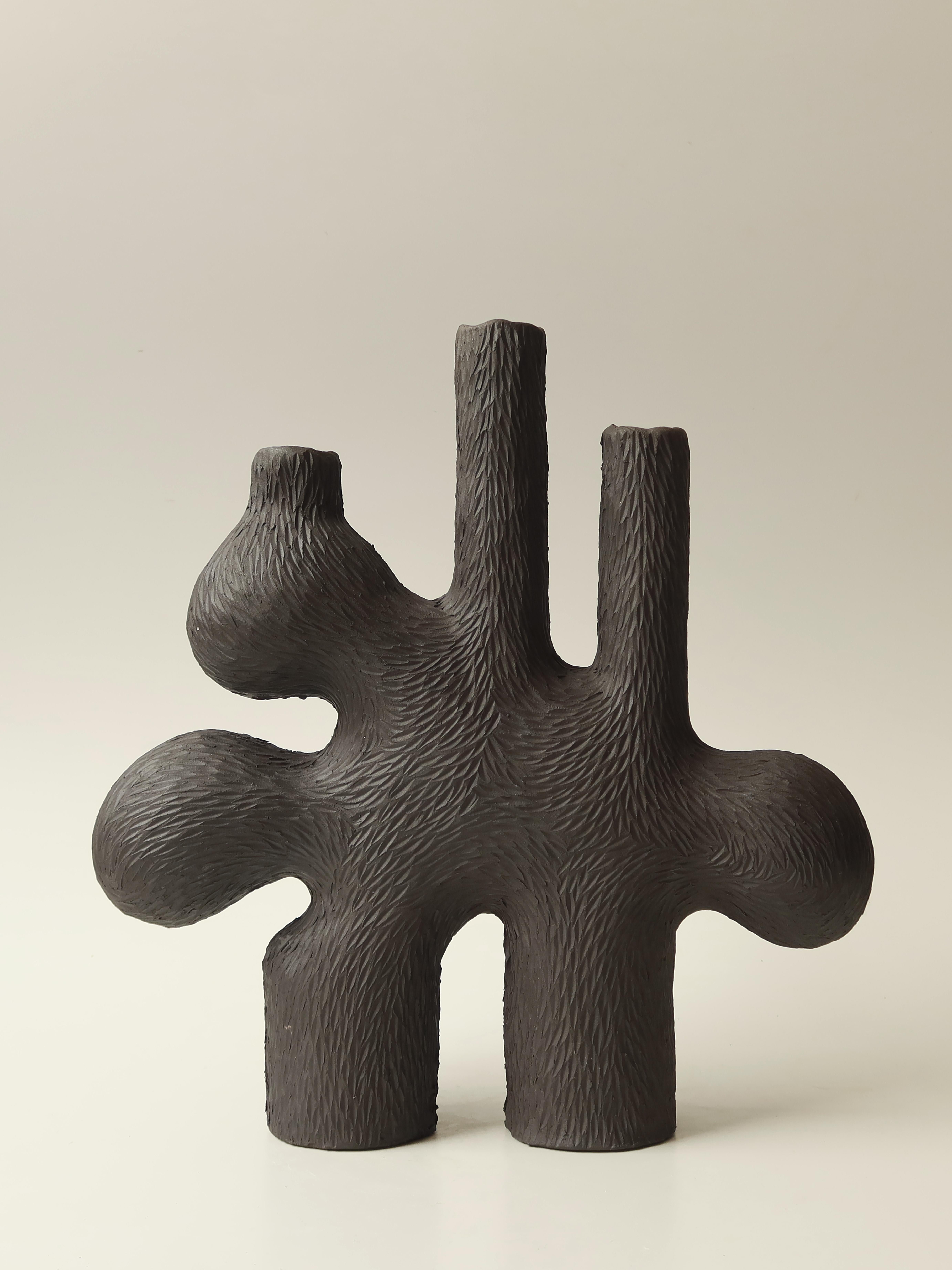 Forest Candelabra no.3 by Jan Ernst
Dimensions: W 40 x D 10 x H 42 cm
Materials: White stoneware, Black clay, Terracotta

Glazed to client specification.


Jan Ernst’s work takes on an experimental approach, as he prefers making bespoke