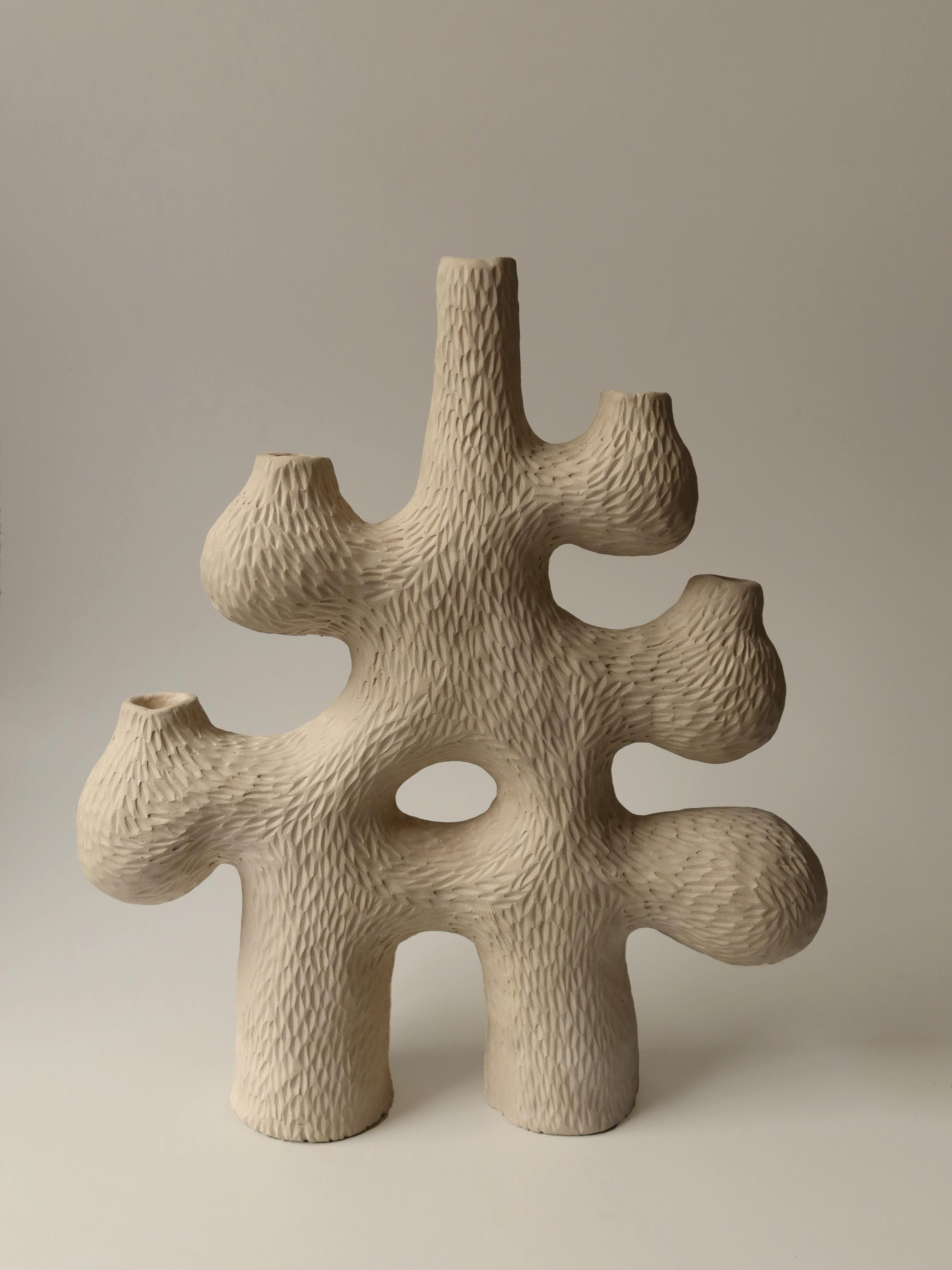 Forest Candelabra no.4 by Jan Ernst
Dimensions: W 42 x D 12 x H 42 cm
Materials: White stoneware, Black clay, Terracotta

Glazed to client specification.


Jan Ernst’s work takes on an experimental approach, as he prefers making bespoke