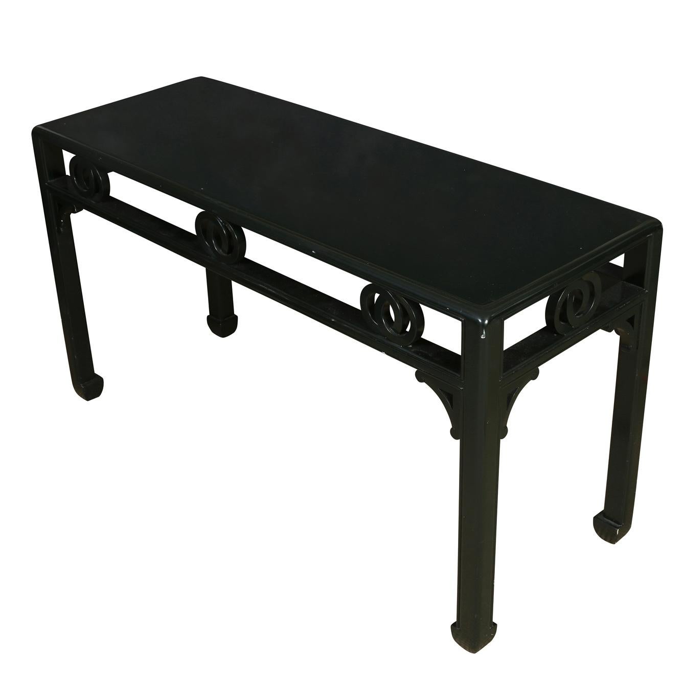 Deep forest green Asian style console table with hoof feet and open work detail to apron.