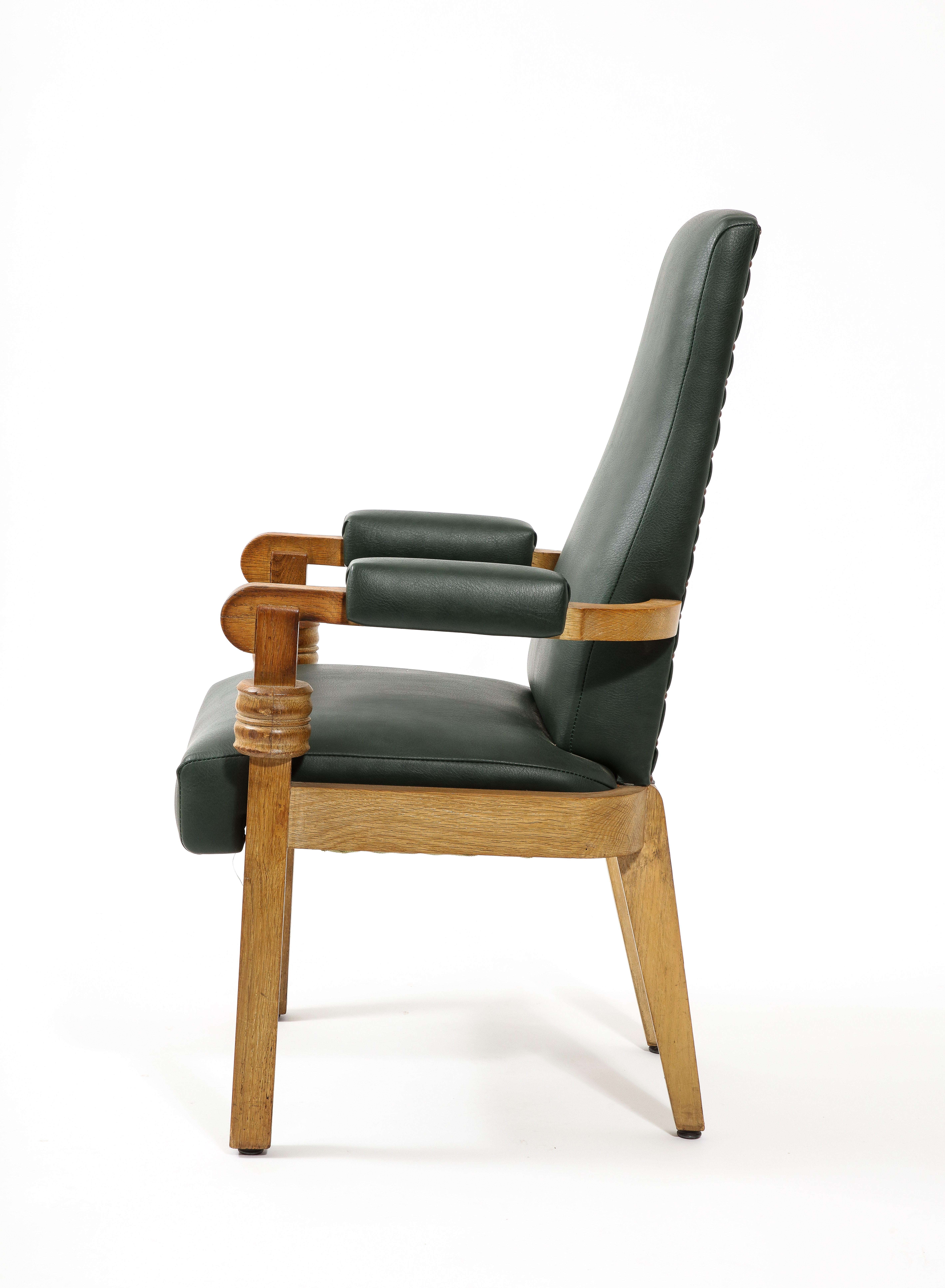 Solid oak armchair with stacking detail in original patina and upholstery.

