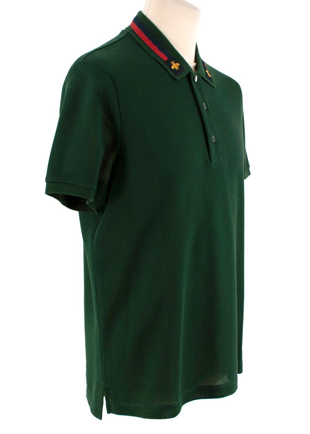Gucci Forest Green Embellished Collar Cotton Pique Polo Shirt

- Deep green cotton pique
- Embellished classic collar featuring web stripe and bee logo
- 3 button placket
- Short sleeve
- Regular fit

Materials 
93% Cotton 
7% Elastane 

Made in