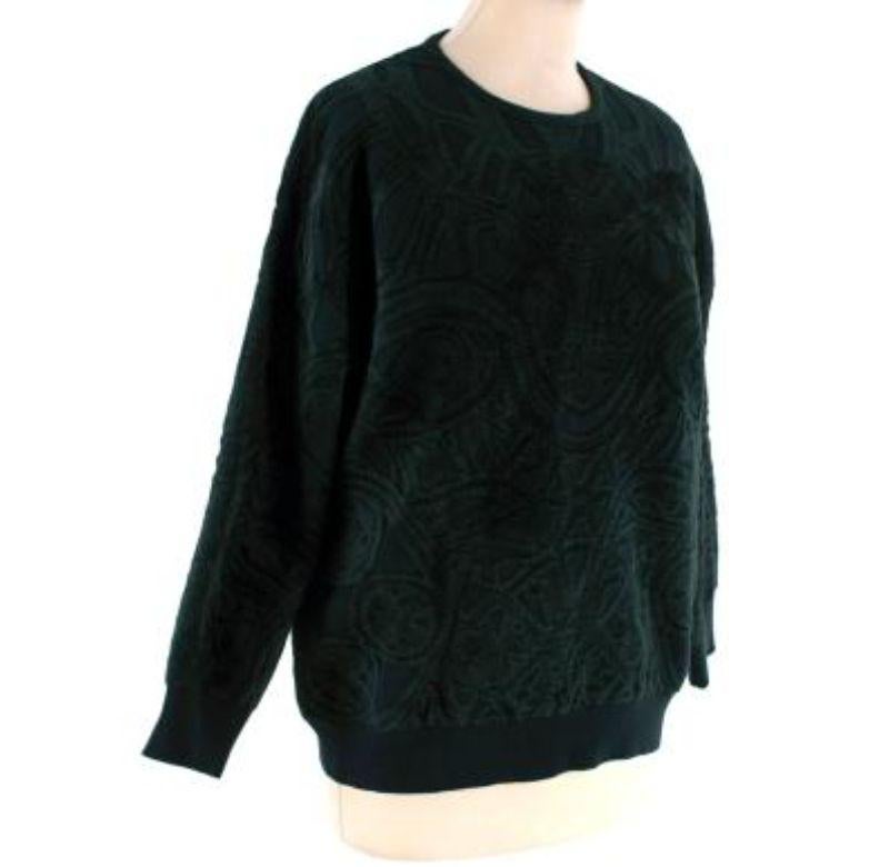Alexander McQueen Forest Green Textured Jacquard Jumper
 
 - Round neck, long sleeve jumper in a densely knitted intarsia pattern
 - Ribbed cuffs and hemline
 
 Materials:
 37% Wool
 37% Viscose
 22% Polyamide
 4% Polyester
 
 
 Made in Italy
 Dry