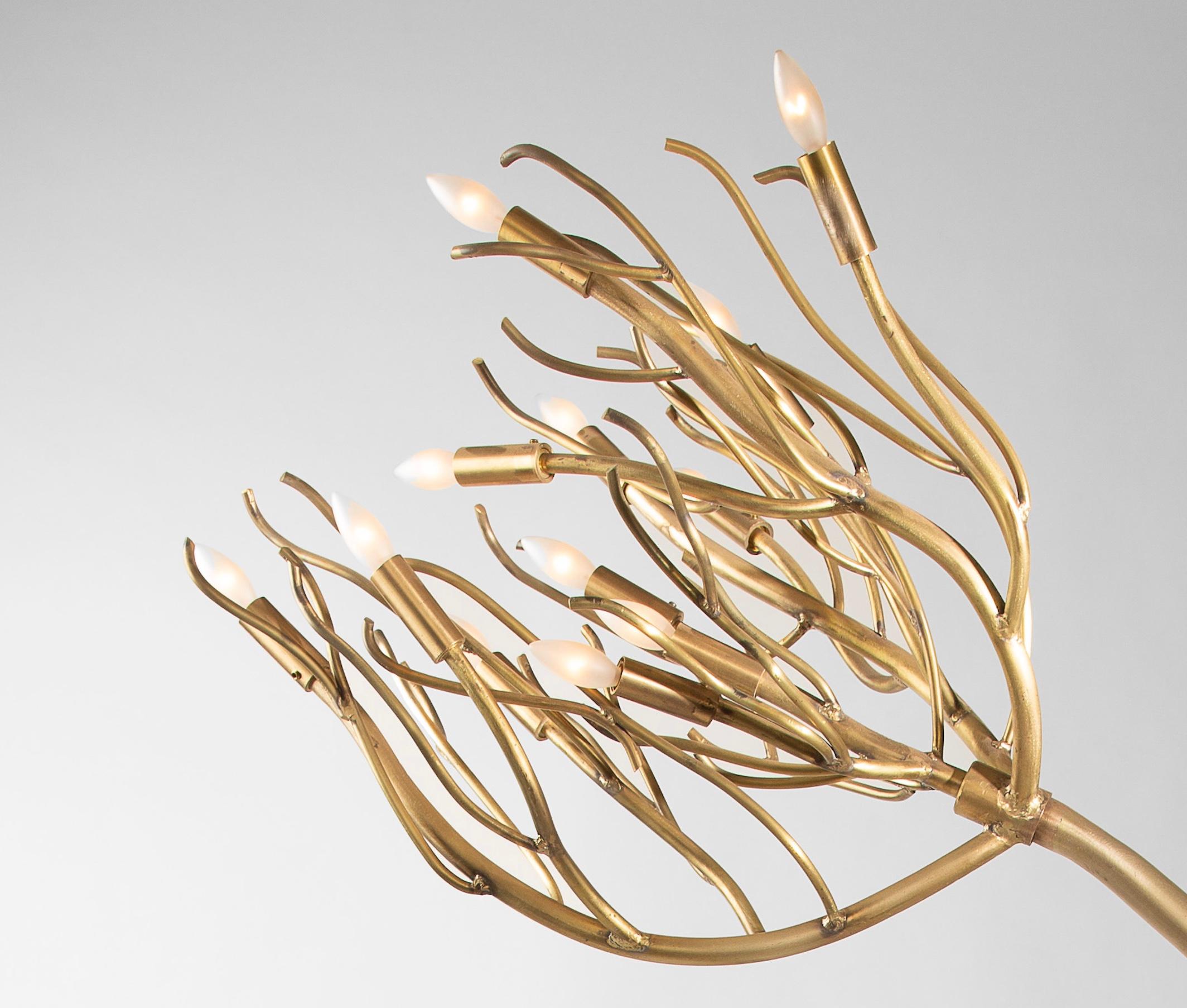 This original, organic modernist design is crafted entirely by hand and features a series of upswept branches circling a slender 