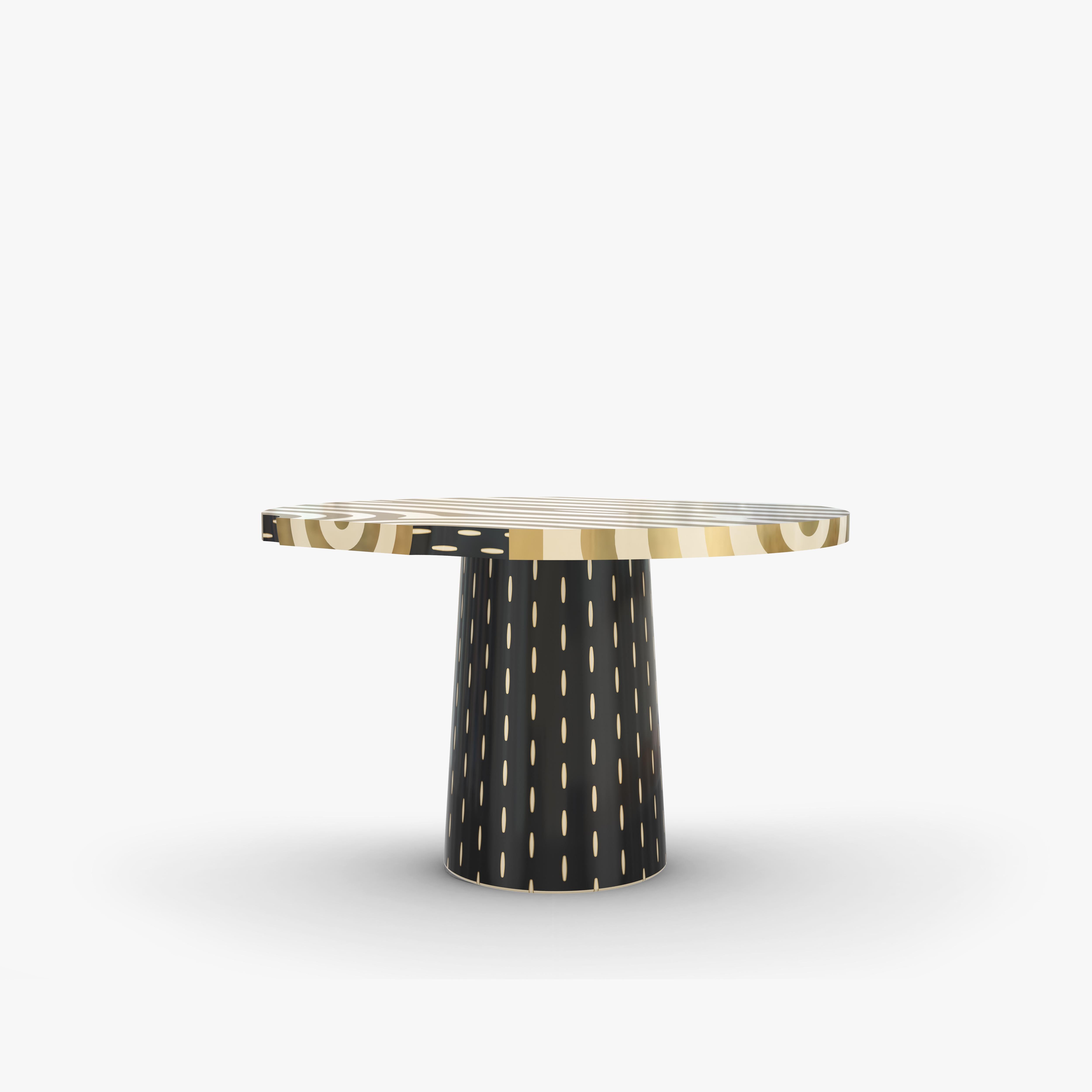 Brass inlay resembles the natural beauty of wood on the top of Forest Round Dining Table, which is poised on a lovely handcrafted base with brass details

For his debut creations, Marcantonio introduced “Vegetal Animal”, a concept that evokes