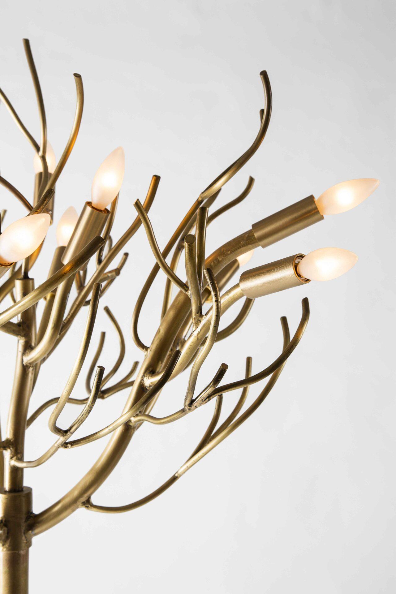 This one-of-a-kind, organic modernist design is crafted entirely by hand and features a series of upswept branches around a slender 