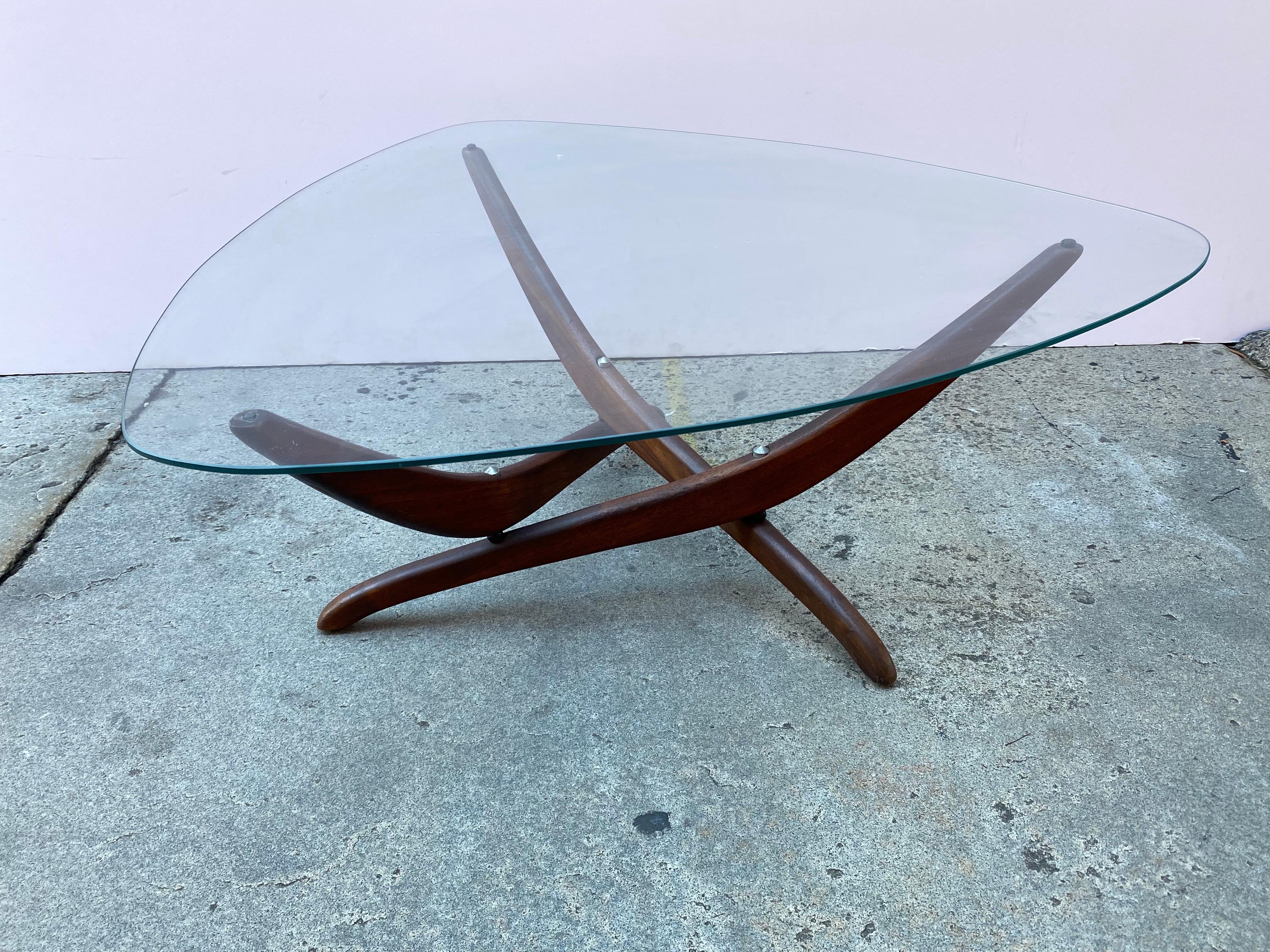 Forest Wilson glass and walnut coffee table. Unique Design attaches 3 curved walnut Legs together with connectors to form a surprisingly sturdy base! Original Triangular Piece of Glass sits on top!