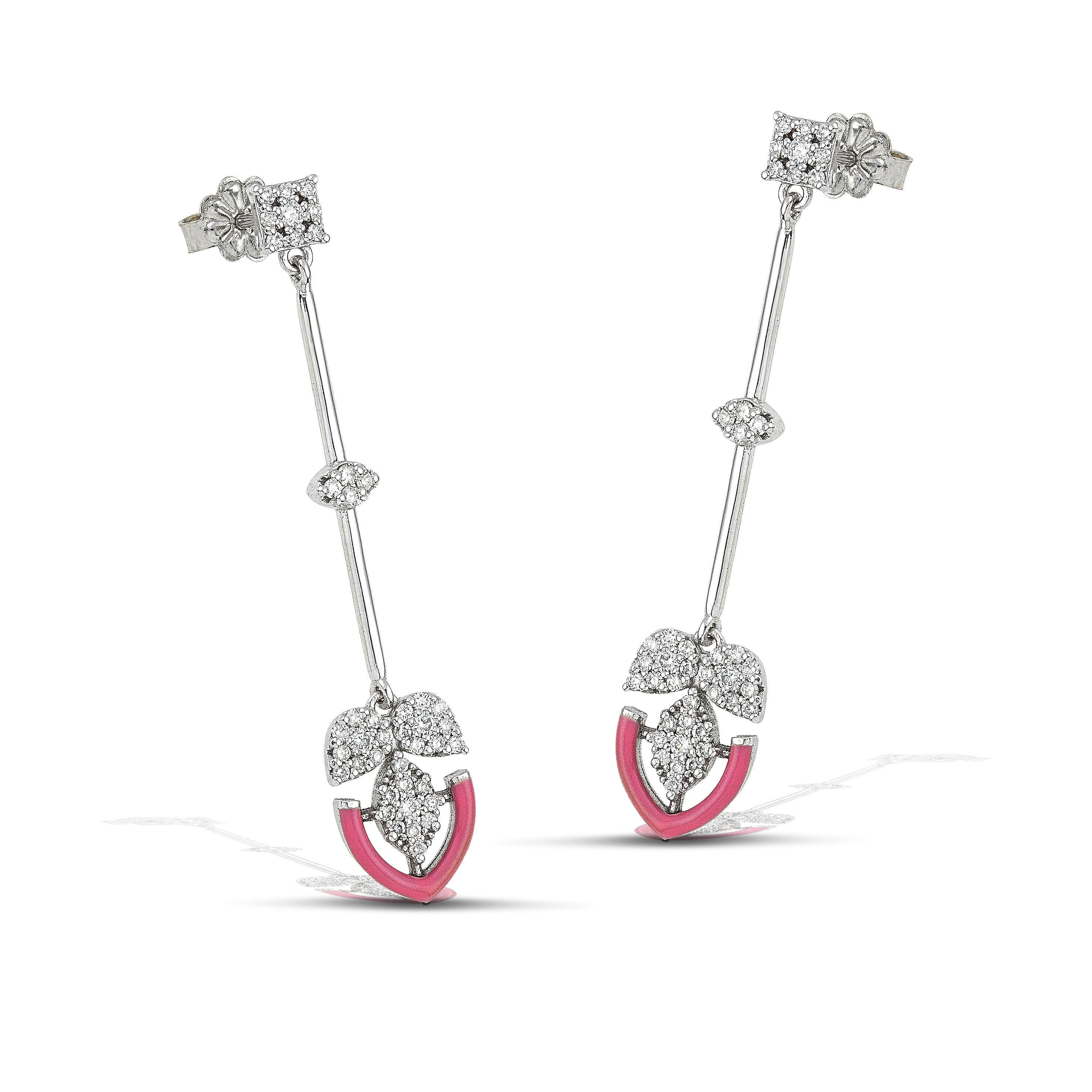 14K gold diamond earrings with a bold navy colour accent, the perfect gift for yourself or a loved one.
100% Recycled 14 K White Gold
Diamonds
Pink Enamel
Size: 5cm/1,96 inches
Inspiration: In the arts, maximalism, a reaction against minimalism, is