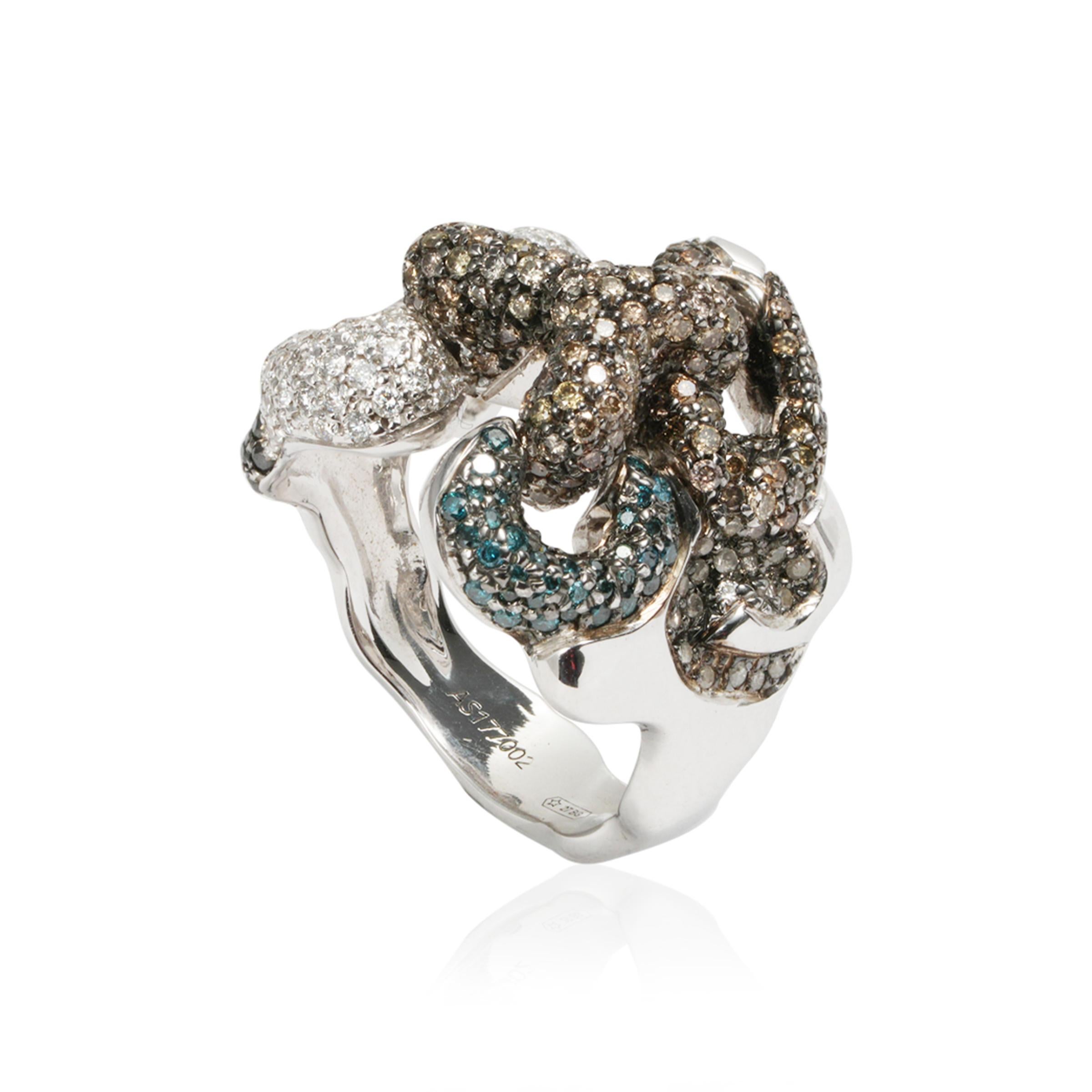 White gold ring from ForEverHug Me collection created with fancy color diamonds and brilliants, icon of the collection signed DAVERIO1933. 

