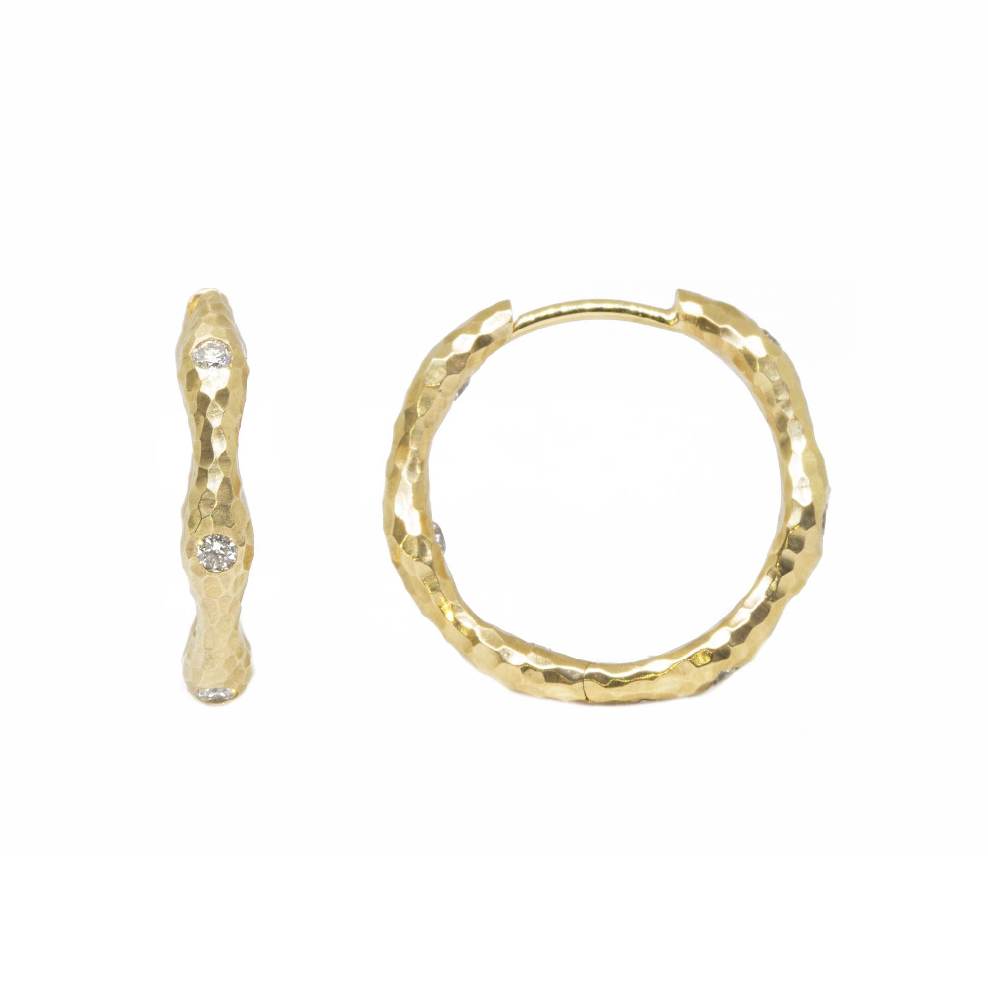 The diamond accented Gold Forged Hoop Earrings are made for dangling your favorite Charms (or a few). Or wear them on their own for an effortless, understated look. 

Metal: 14K Yellow Gold
Diamond carat: 0.45
Size: 22mm
Diamond size: 2mm

The