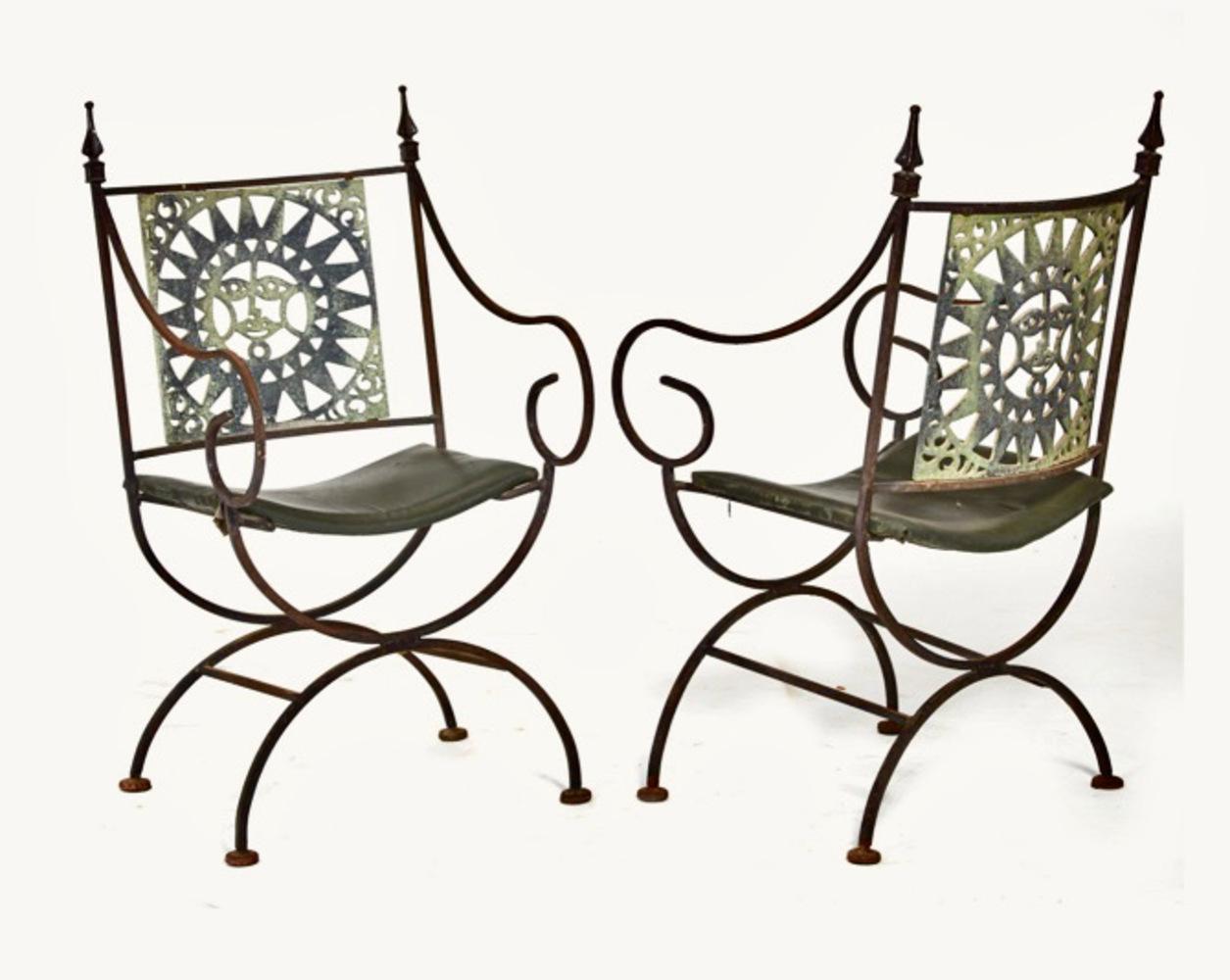 This is a whimsical set of four mid-century forged and cast iron Savonarola -inspired arm chairs. We are attributing the chairs to a mid-century Mexican origin. These are the perfect covered patio chairs, perhaps breakfast room chairs that would add