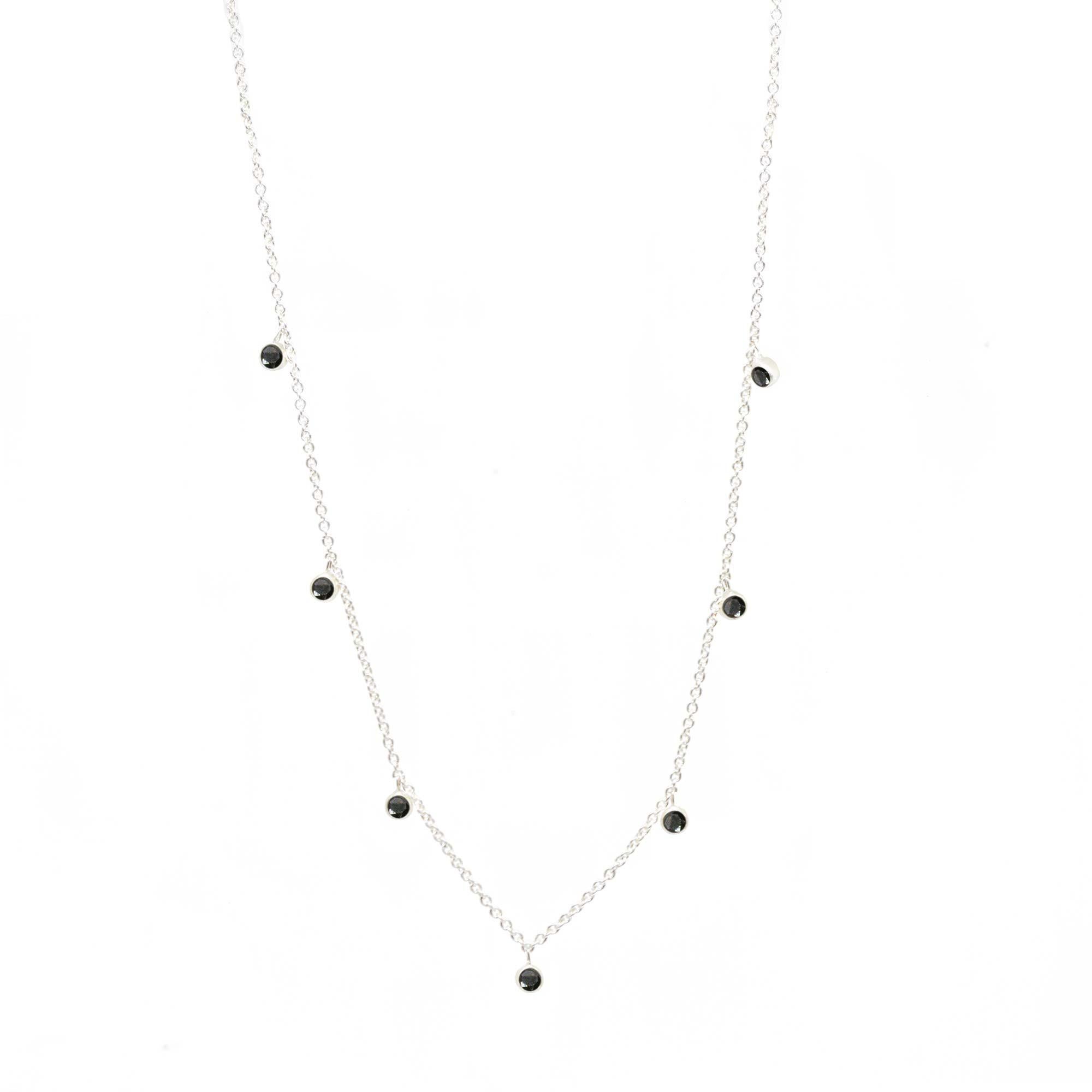 Made with black spinel gemstone rimmed in sterling silver, our Forged Silver Necklace provides an effortless, yet fashionable style. 

Metal: Sterling Silver
Stone carat: 0.75
Length: 15-17''
Stone size: 2.5mm

About the stones:
Genuine Black
