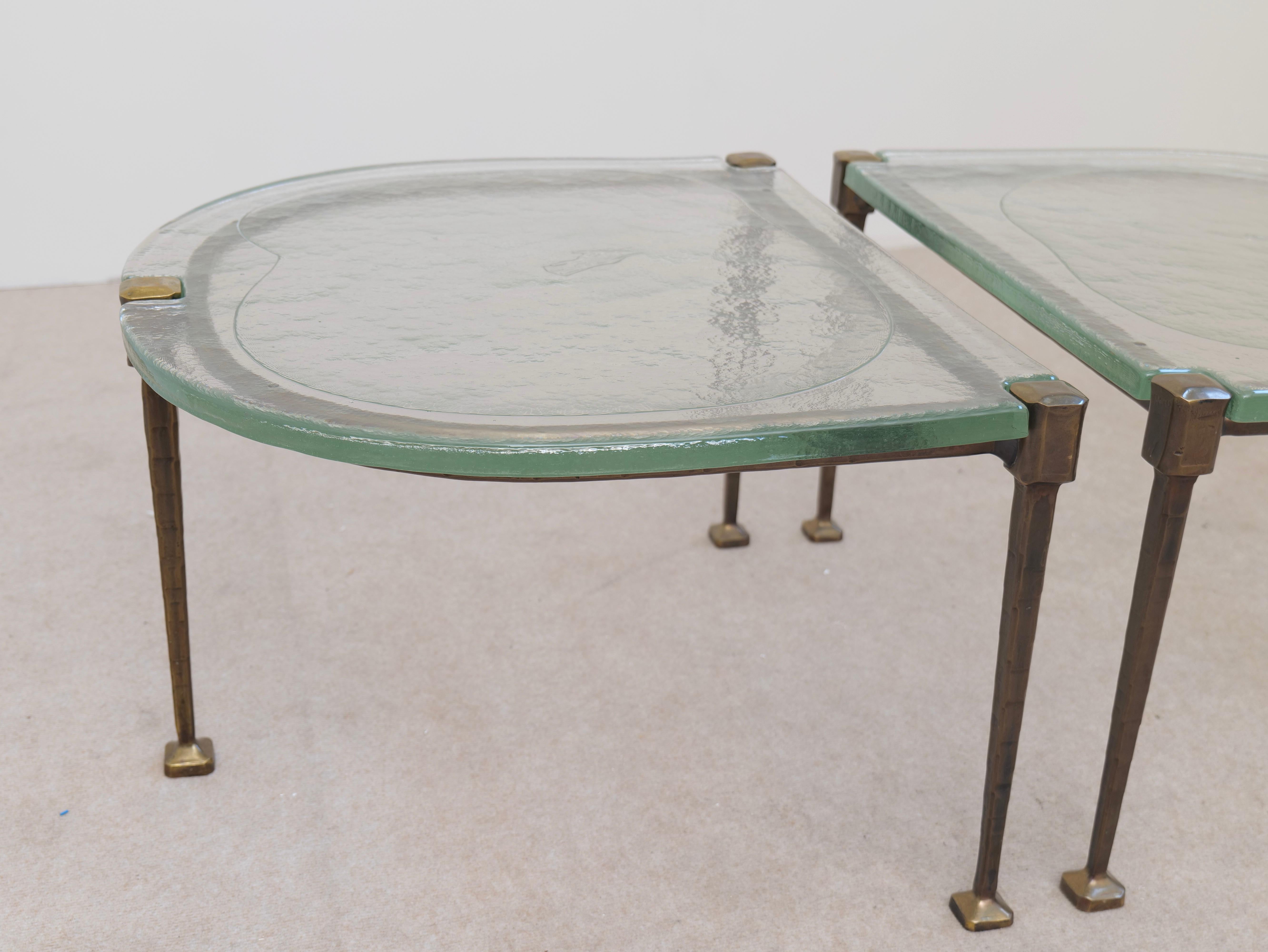 Brutalist forged bronze coffee tables by Lothar Kute with green glass For Sale