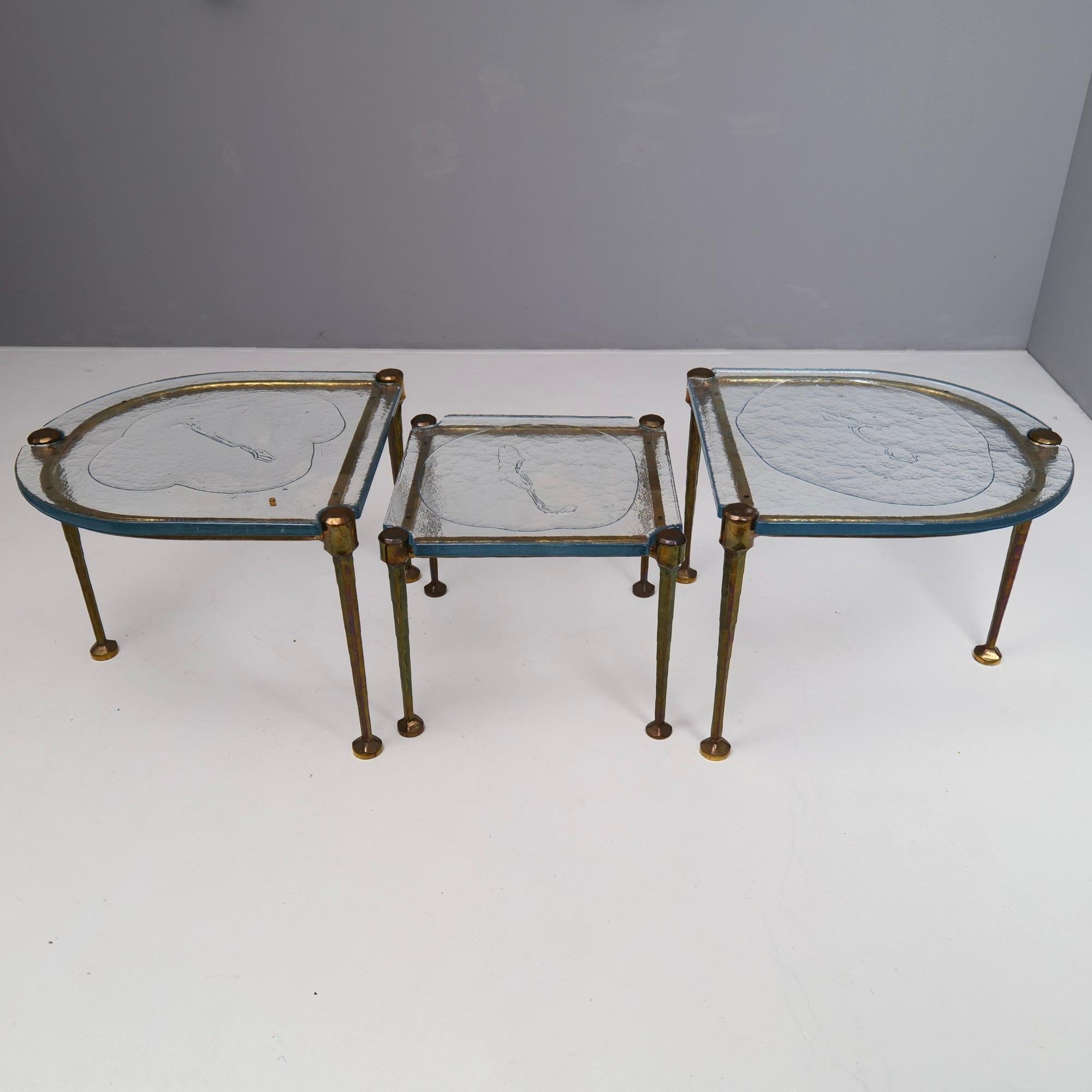 Brutalist tables made of forged bronze and cast glass from the 1980s. 
In modern times, the production of such tables would be impossible for reasons of cost and performance.

3 cm thick crystal glass 
Dimensions:
Center table:
51 cm x 51 cm , 43 cm