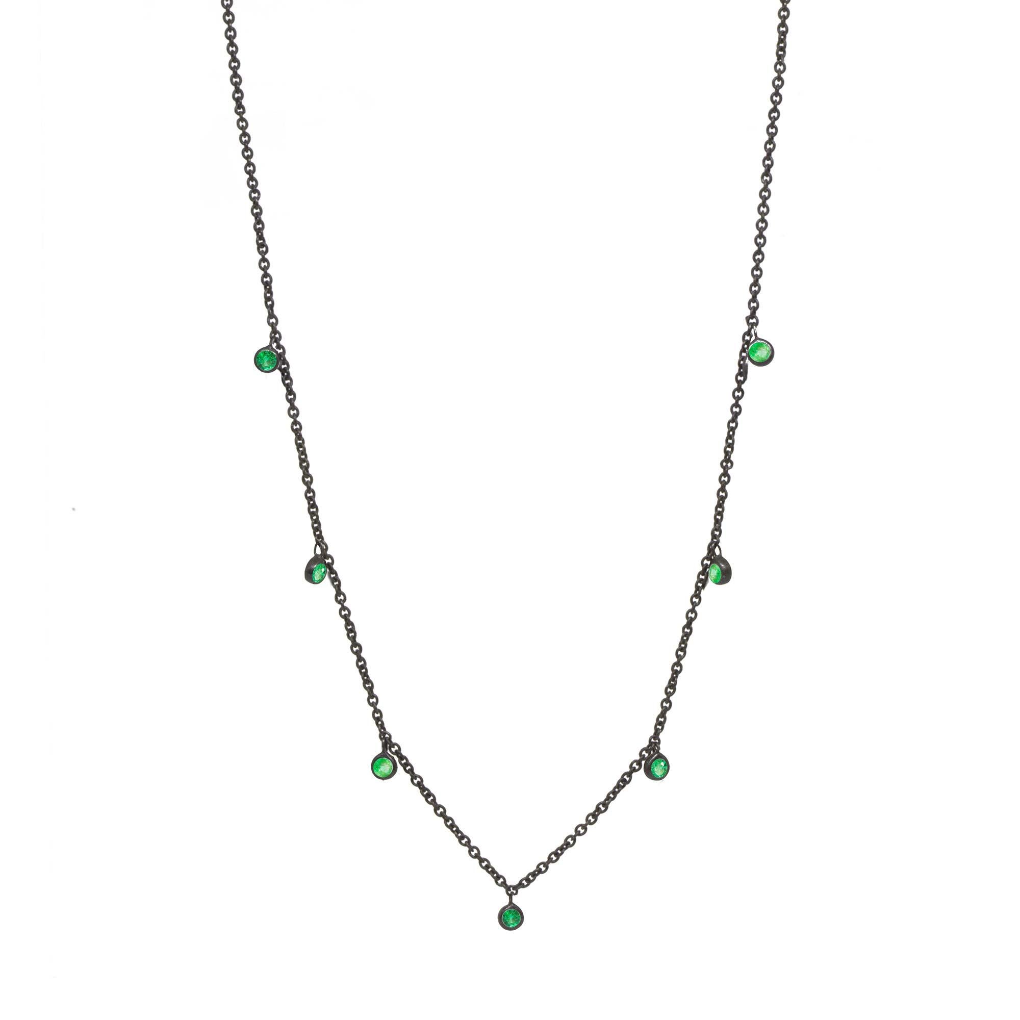 Made with emerald gemstone rimmed in black oxidized silver, our Forged Silver Necklace provides an effortless, yet fashionable style. 

Metal: Black Oxidized Silver
Stone carat: 0.75
Length: 15-17''
Stone size: 2.5mm

About the stones:
Genuine