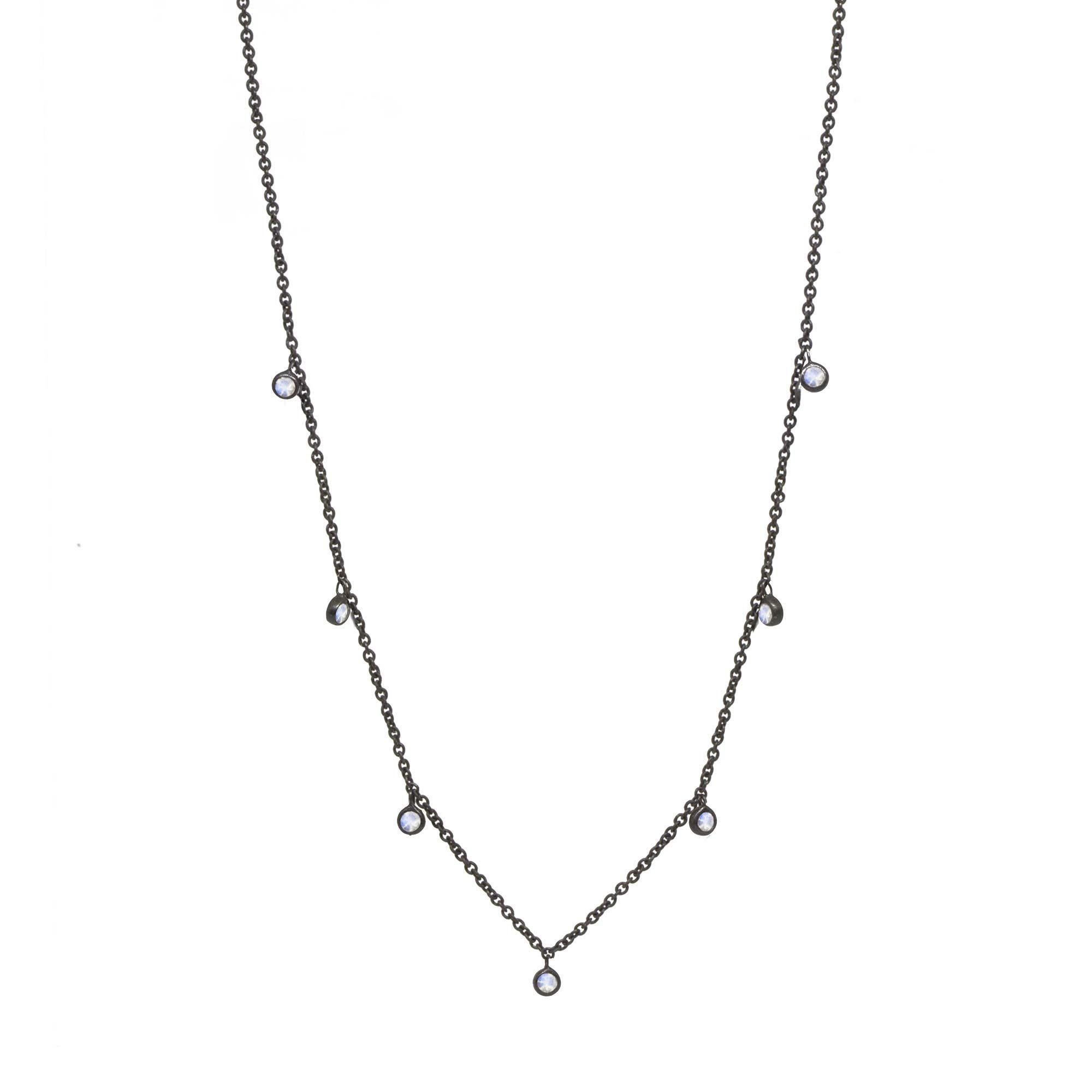 Made with moonstone gemstone rimmed in black oxidized silver, our Forged Silver Necklace provides an effortless, yet fashionable style.
 
Metal: Black Oxidized Silver
Stone carat: 0.75
Length: 15-17''
Stone size: 2.5mm

About the stones:
Genuine