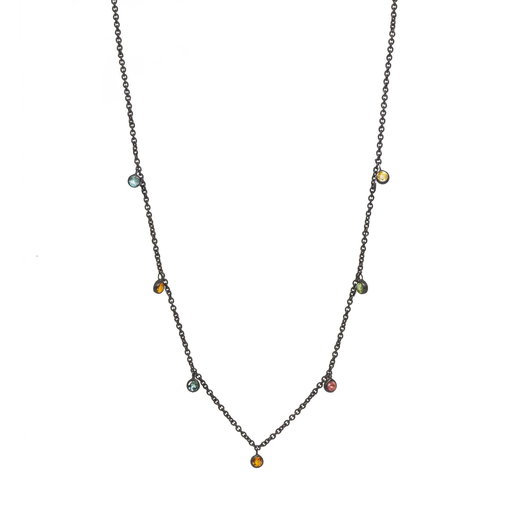 Made with multi tourmaline gemstone rimmed in black oxidized silver, our Forged Silver Necklace provides an effortless, yet fashionable style. 

Metal: Black Oxidized Silver
Stone carat: 0.75
Length: 15-17''
Stone size: 2.5mm

About the