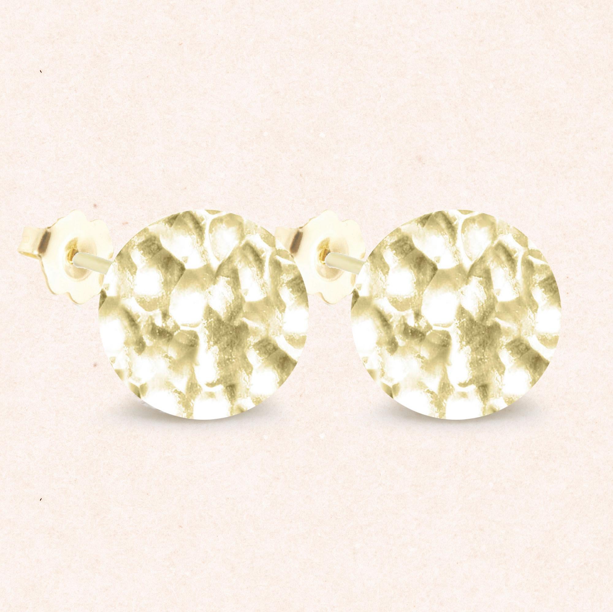 Nina Nguyen Design's patent-pending earrings have an element on the back of the stud or charm to allow these pieces to transformed into multi-use, stackable and convertible styling. It can be turned into a pendant and worn on a necklace, or used as