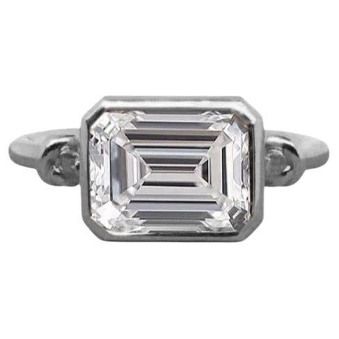 Forget Me Knot Emerald Cut Diamond ring in 18ct Gold