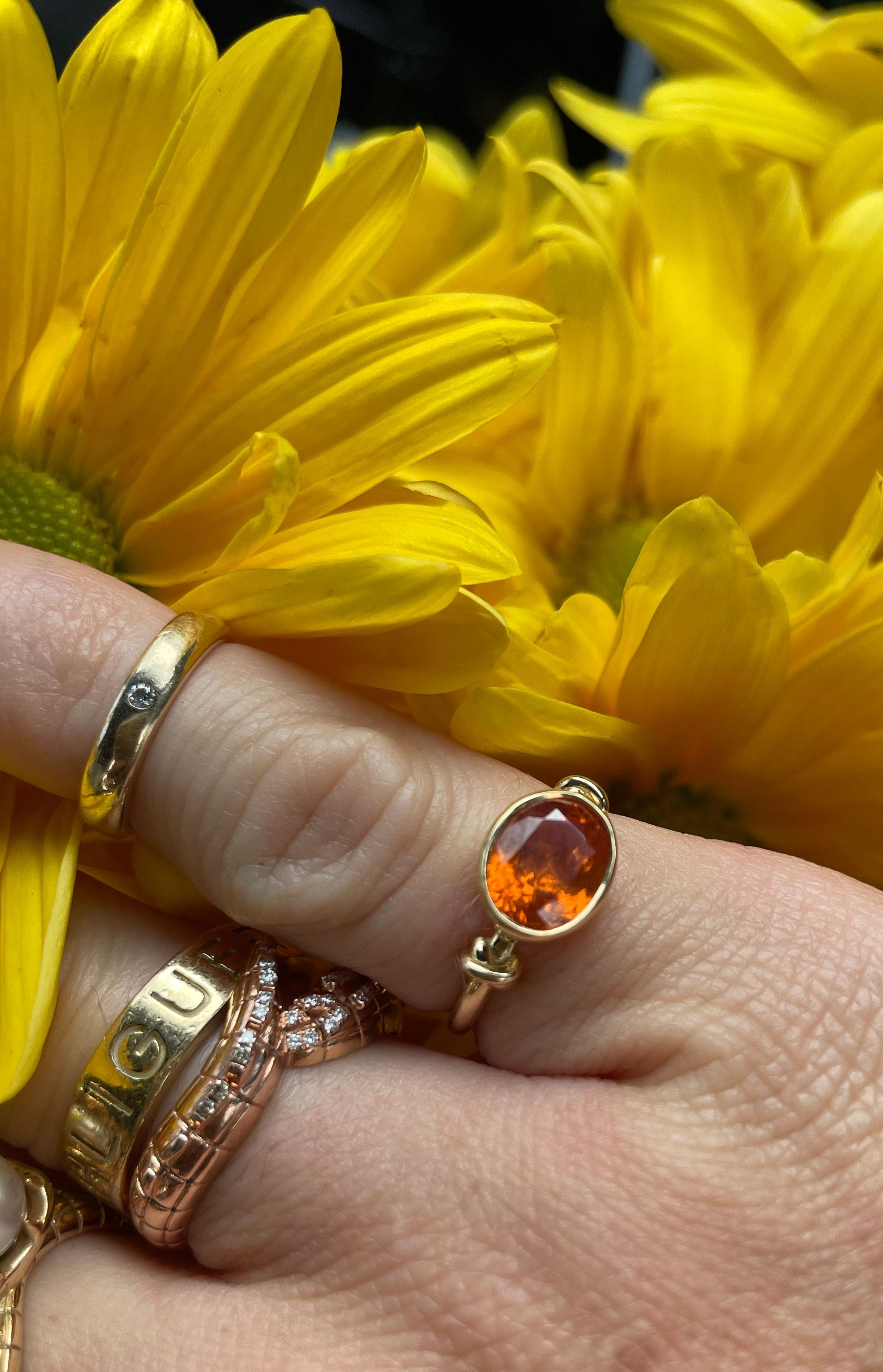 For Sale:  Forget Me Knot Mandarin Garnet Ring in 18ct Yellow Gold 7