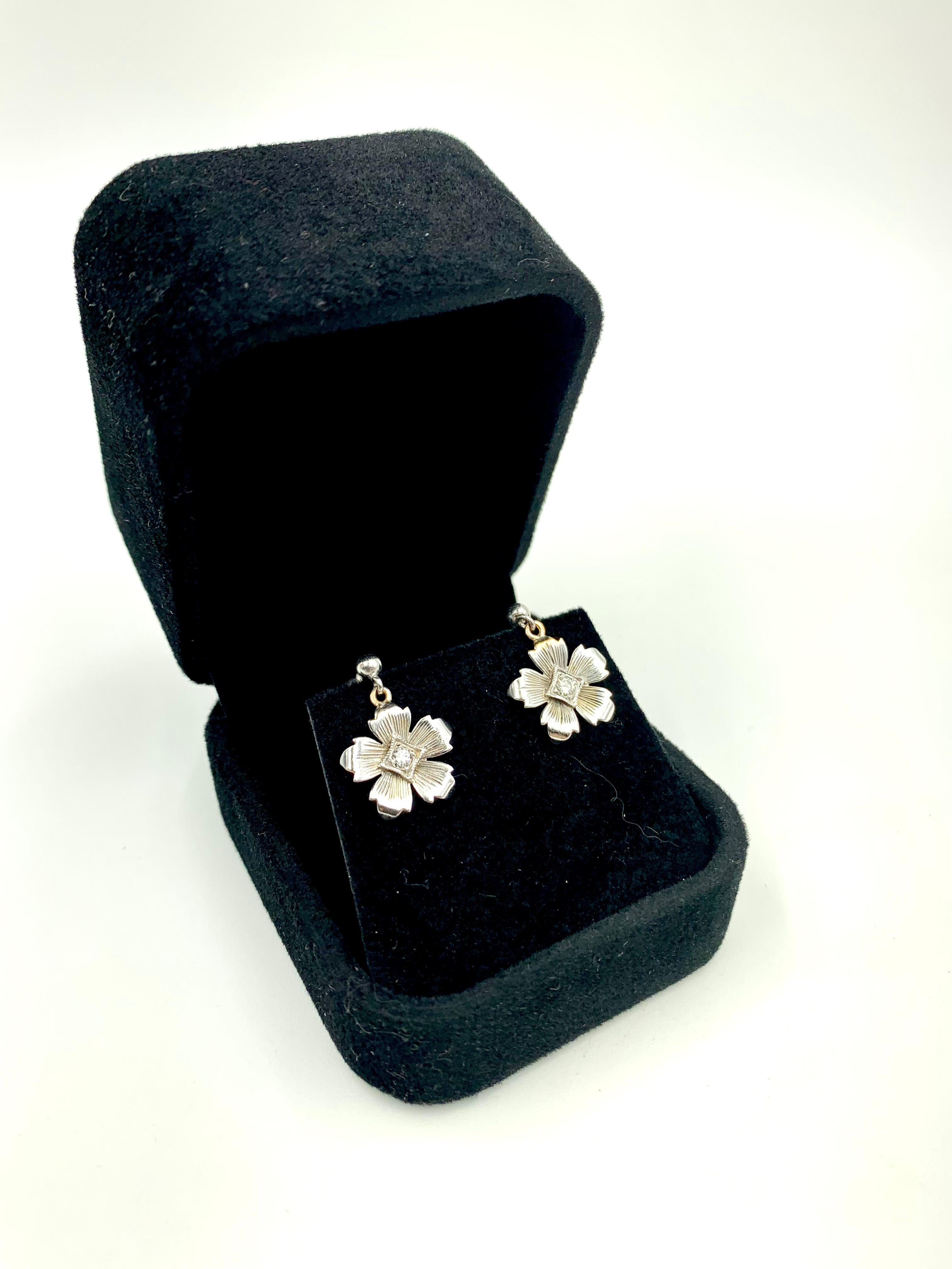 Lovely, romantic Forget-Me-Not flower earrings in 14K white gold with central diamond accents in a stylized diamond shaped setting. Beautiful handwrought details, signed on the back with the makers mark B and 14K.
Very good condition, for pierced