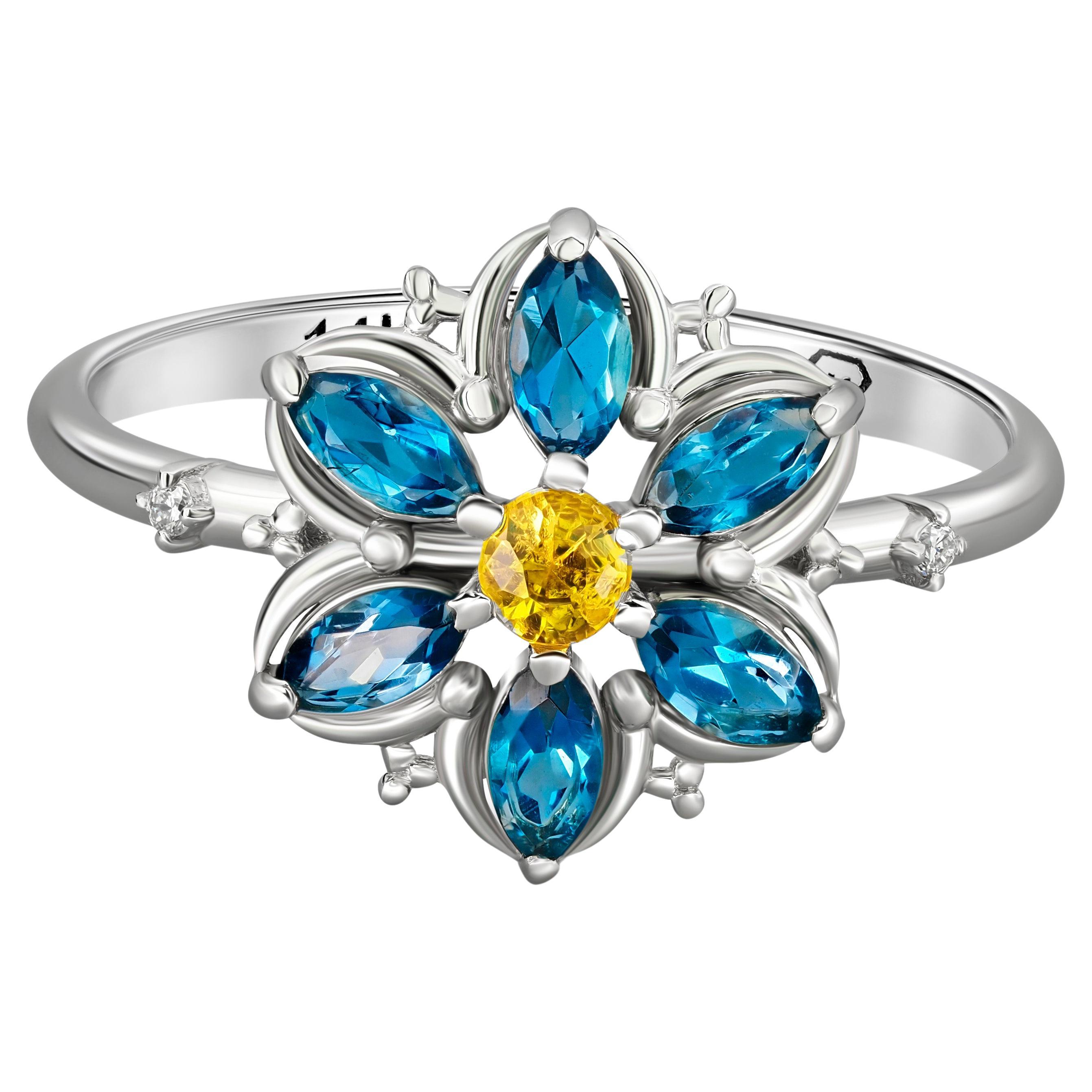 Bague Forget Me Not en or avec topaze. 