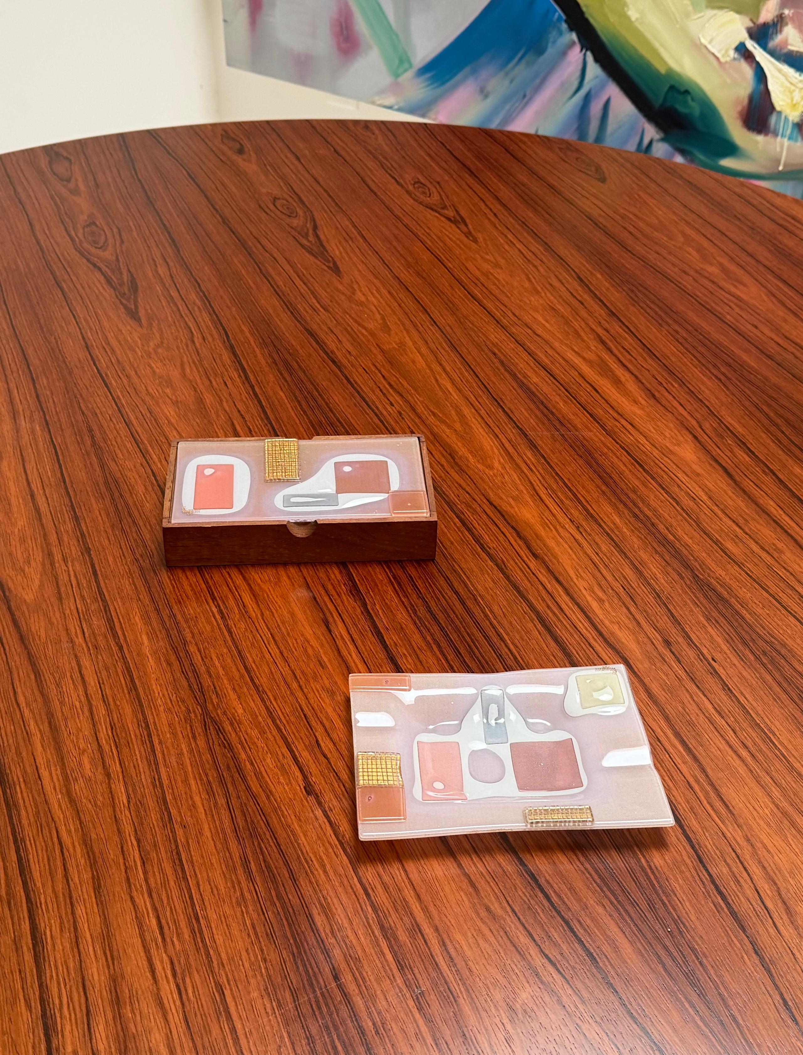 Incredible matching handcrafted Forget Me Not  lided box with matching ash tray. This handcrafted set is in excellent condition and is comprised of fused glass with a pieced pattern in pinks with gold decoration.