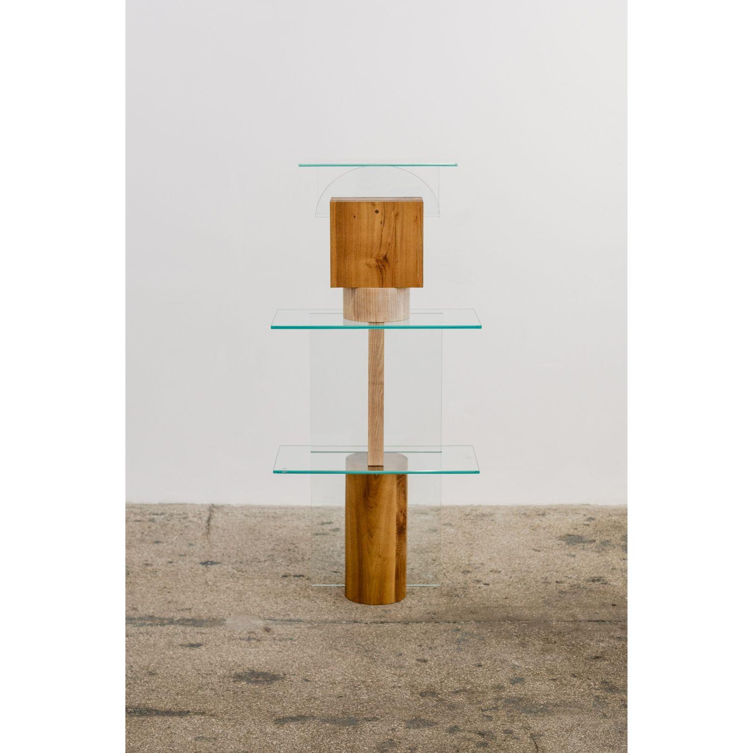 Form 2 by Radu Abraham
A limited series of 10, currently at nr. 2
Materials: Acacia wood, ash wood, glass
Dimensions: 60 x 30 x 132 cm

Massive rectangular and round shapes, made out of acacia and ash wood; the totem is made out of 3 smaller