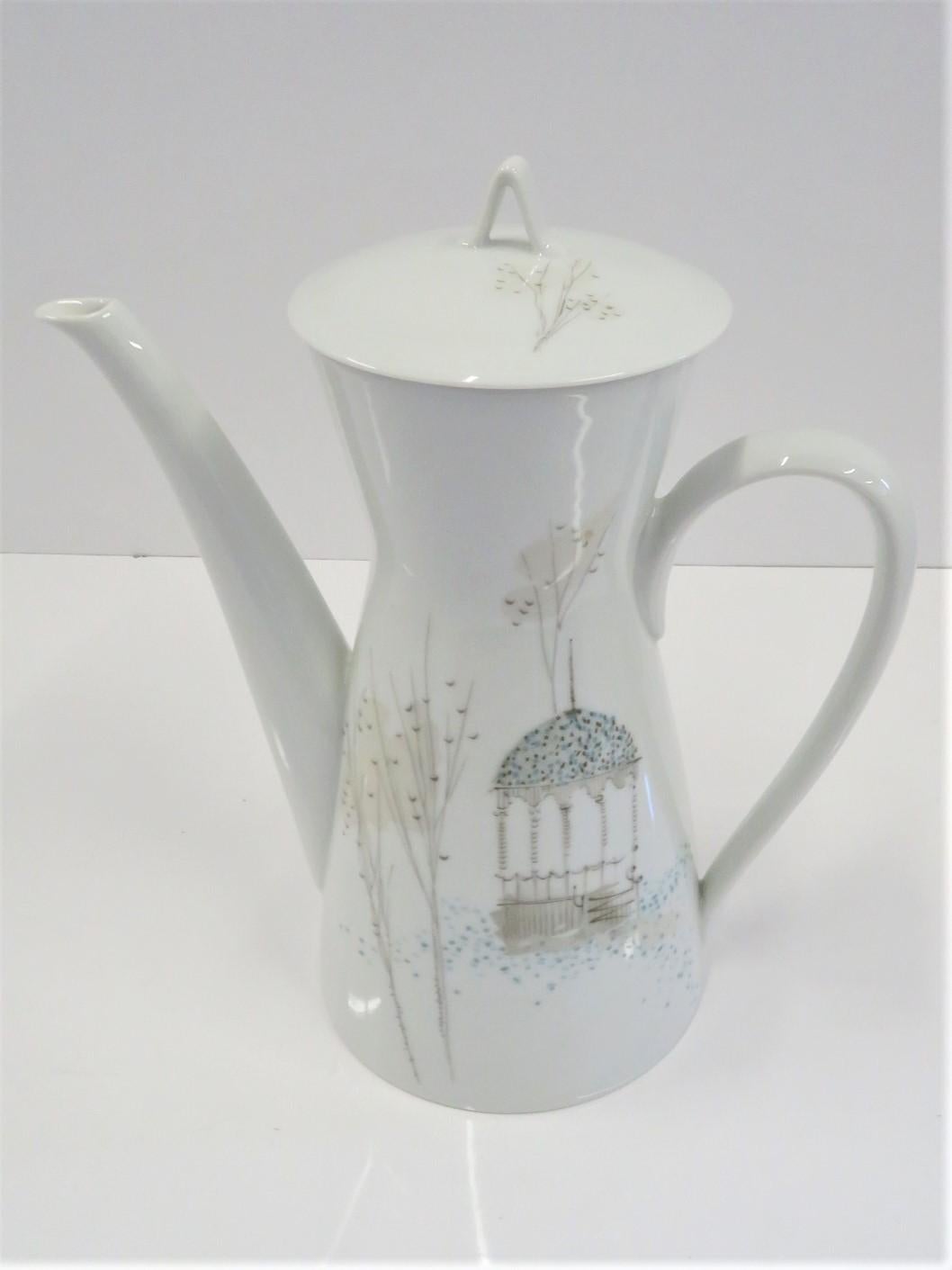 Lovely Rosenthal porcelain coffee pot designed by Raymond Loewy in the Classic Modern Form 2000 shape and with the Rendezvous decoration. The decoration depicts a gazebo in garden with stylized bare trees in an Autumn day. A soft color palette of