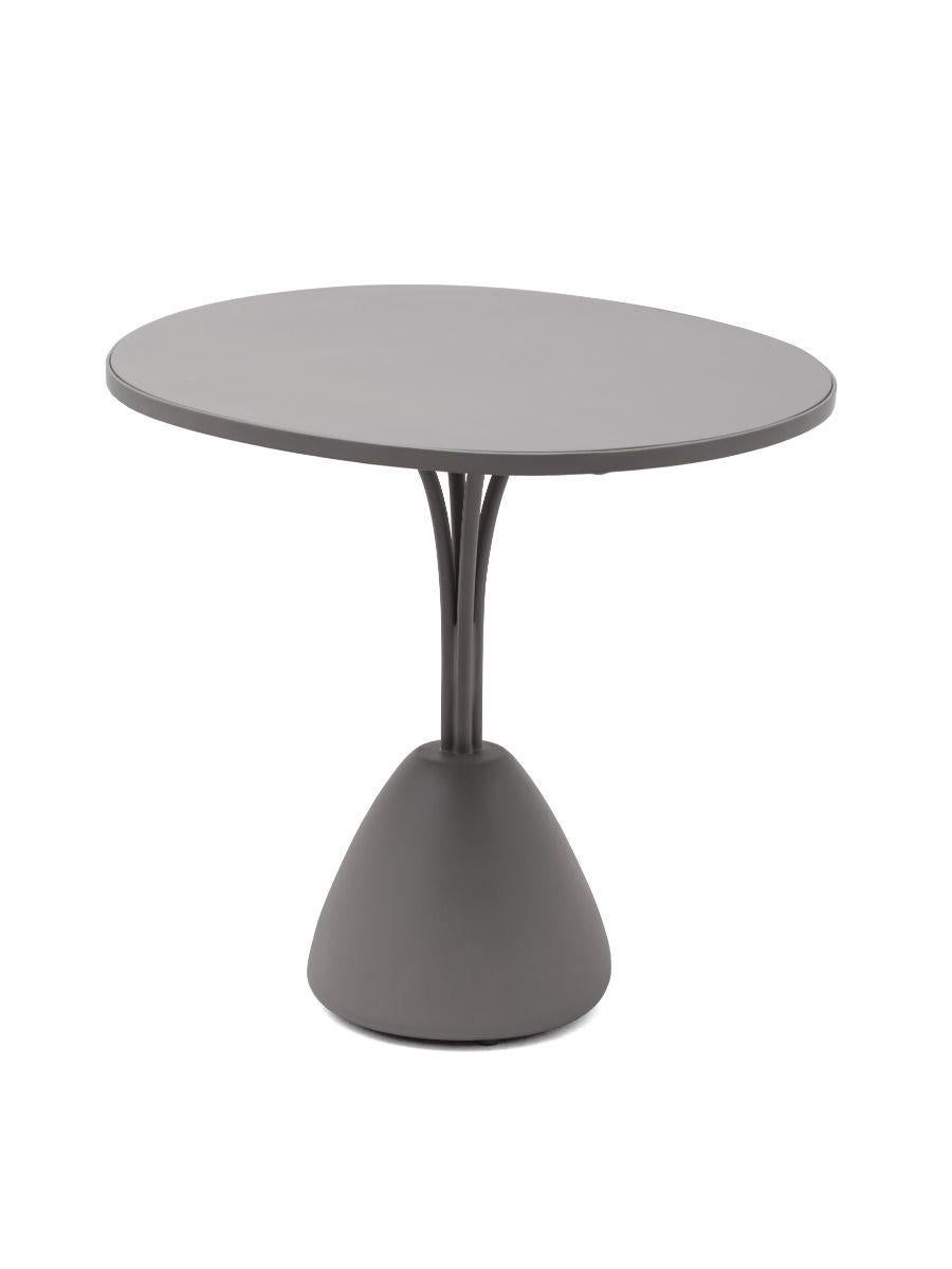 Forma bistro table by Kenneth Cobonpue.
Materials: fiberglass, aluminum. 
Also available in colors: gray and white.
Dimensions: 74.5 cm x 70 cm x H 65 cm 

A contemporary collection perfect for both indoor and outdoor spaces, the balanced shape