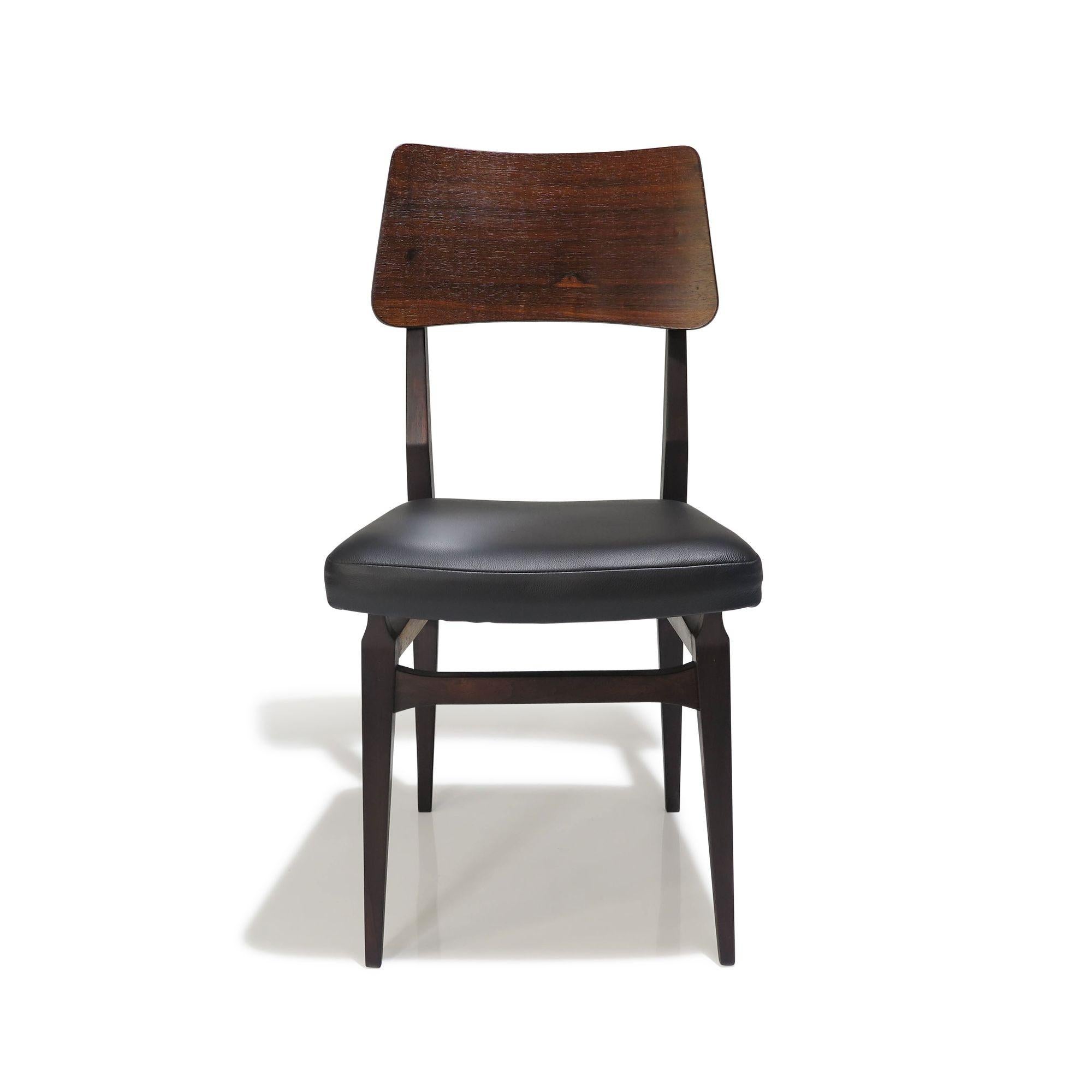 Brazilian rosewood dining chairs by Forma Móveis e Objetos de Arte, 1957, Brazil. In the manner of Carlo Hauner and Martin Eisler, this set of six vintage dining chairs is crafted from solid rosewood, featuring newly upholstered seats in black