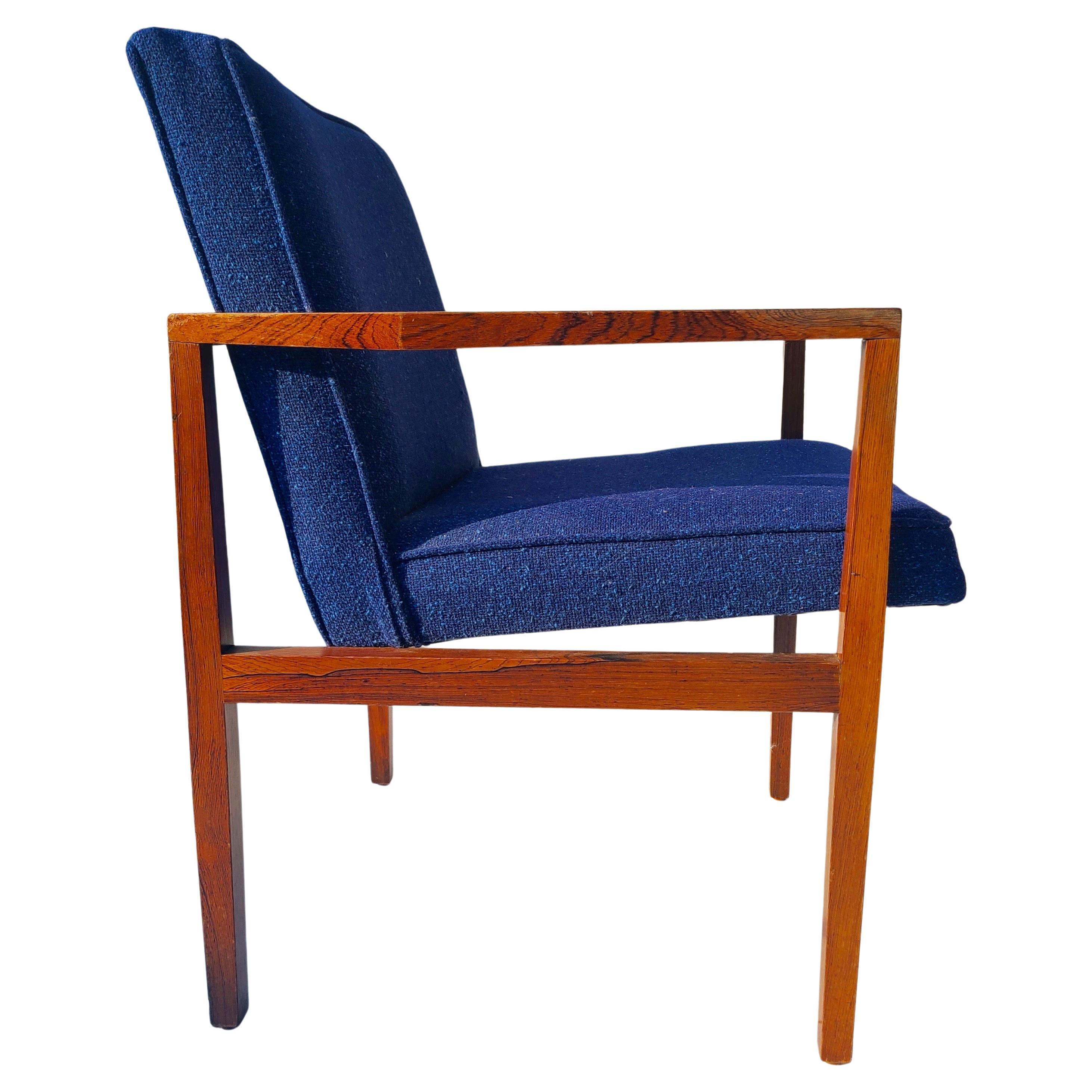 Rosewood open arm chair. Designed by Lewis Butler for Knoll.
Unrestored.
Scratch at elbow rest right hand seated.

 
