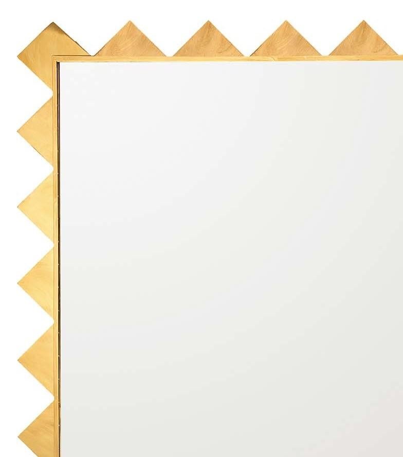 This unique and sophisticated mirror will be a splendid addition to a modern or eclectic interior, where it can be an ideal welcoming piece in the entryway or a decorative addition to a living room, bedroom, or powder room. Its rectangular shape is