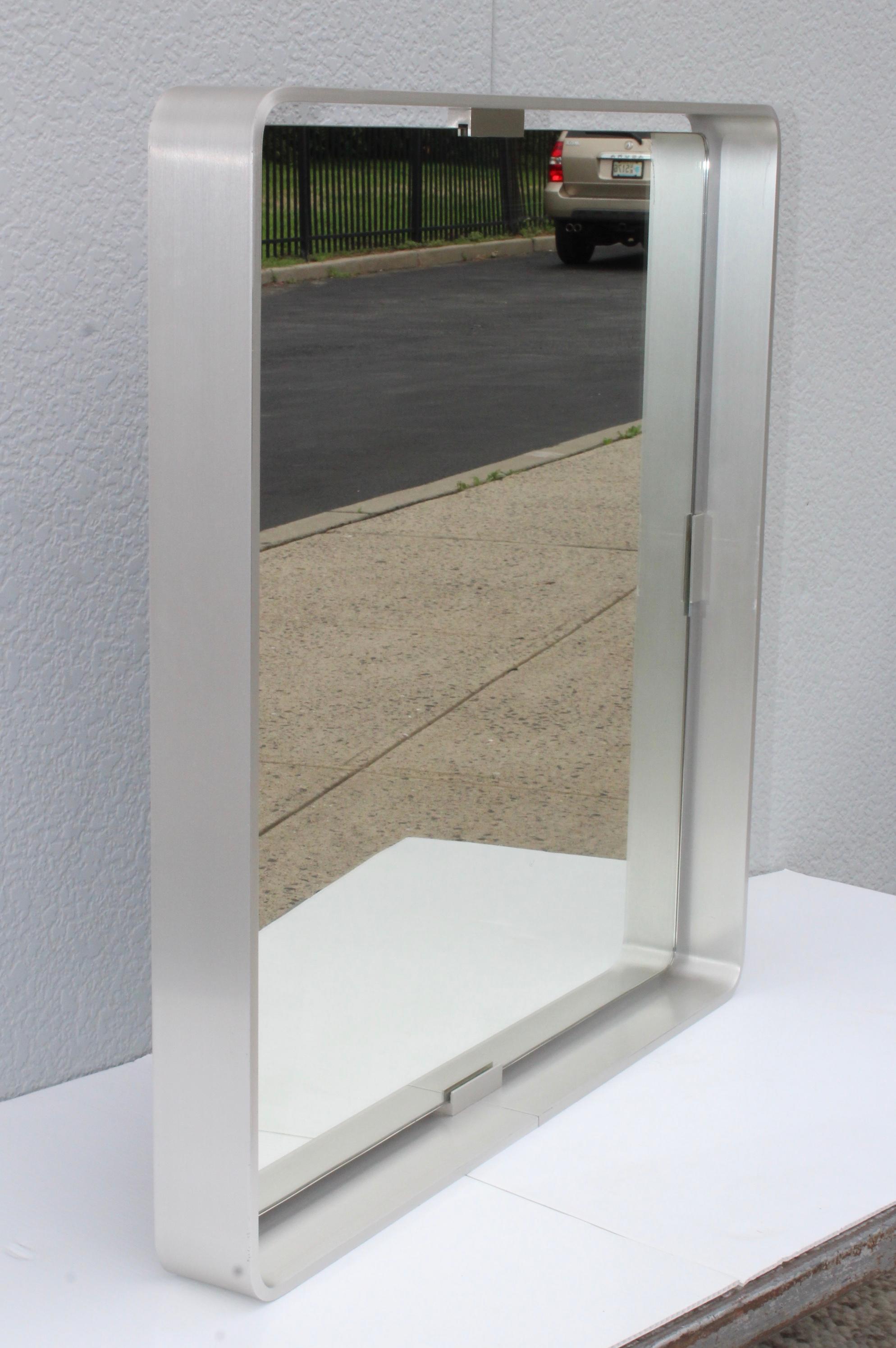 1970s Mid-Century Modern Italian steel mirror by Forma Nova, well made and very heavy.

A larger version also available.