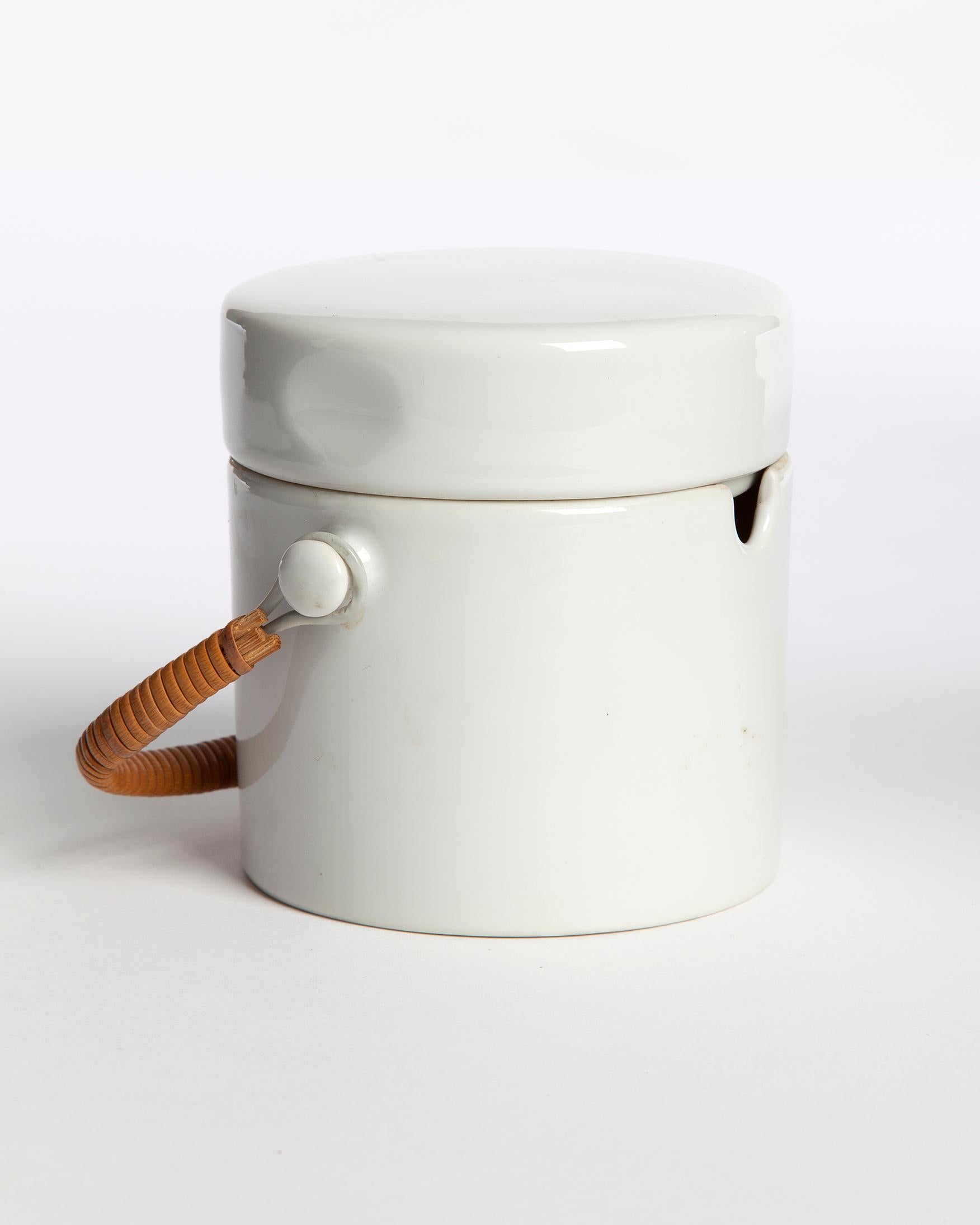 Porcelain sugar bowl with lid and cane handle from the 