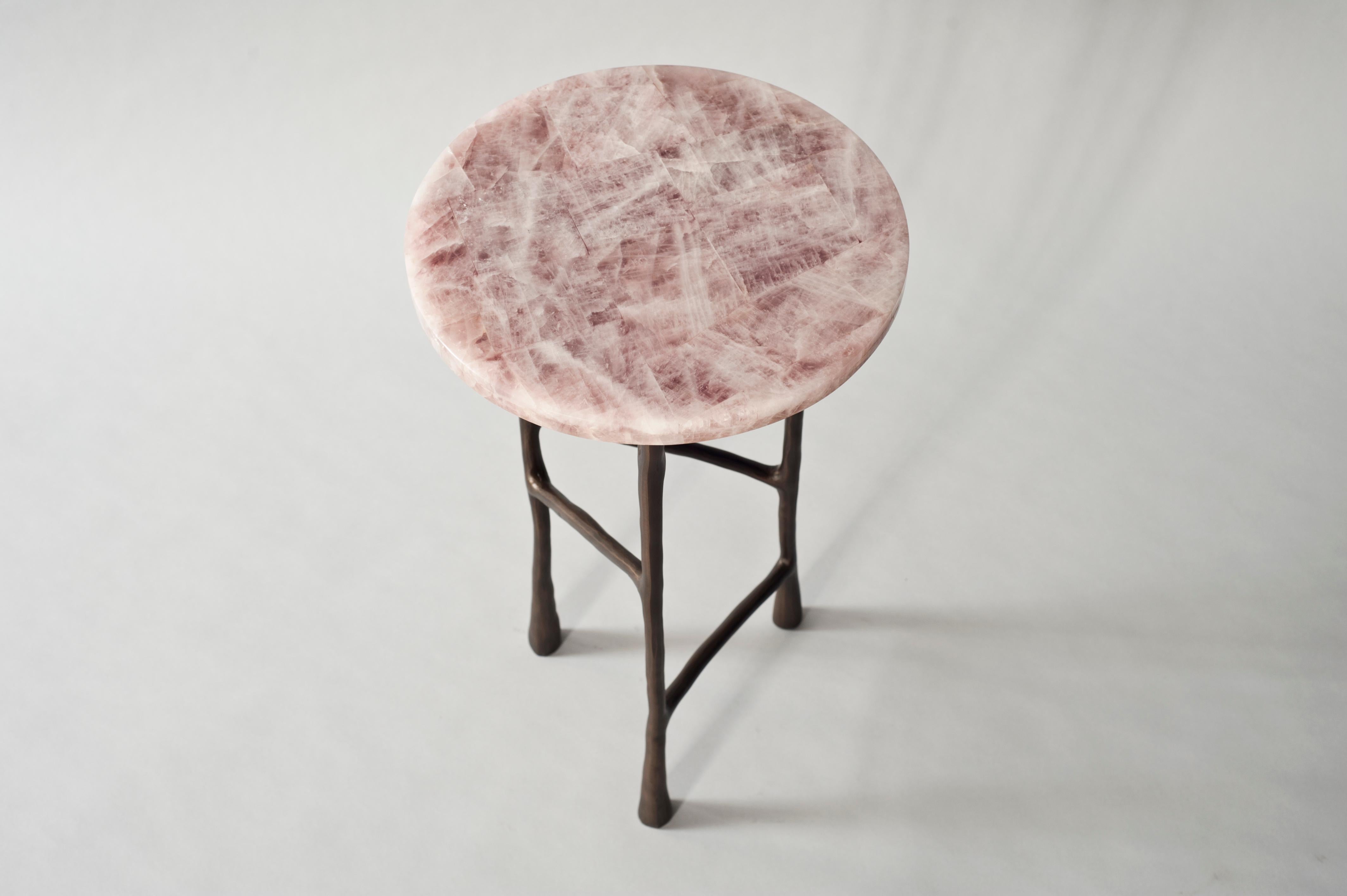 Forma side table by DeMuro Das
Dimensions: 32 x H 54 cm
Materials: Quartz (Rose) -Polished (Random)
 Solid bronze (Antique)

Dimensions and finishes can be customized.

DeMuro Das is an international design firm and the aesthetic and cultural