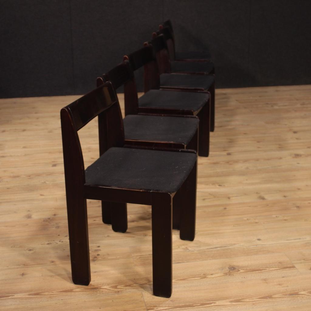 Group of six Italian design chairs from the 1980s. Formanova production furniture carved in mahogany wood of beautiful line and pleasant decor. Moderate comfort seats built with wooden panel covered in fabric without padding. Lounge or living room