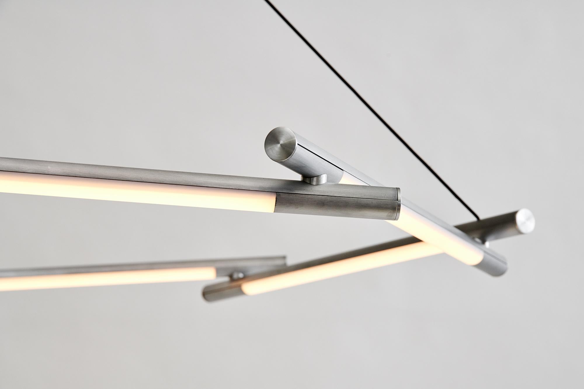 An angular, industrial take on a classic luxury object. A centerpiece to illuminate and elevate any space.
The core design is a set of interlocking extruded aluminum profiles. The dimmable LED source can provide either functional or ambient