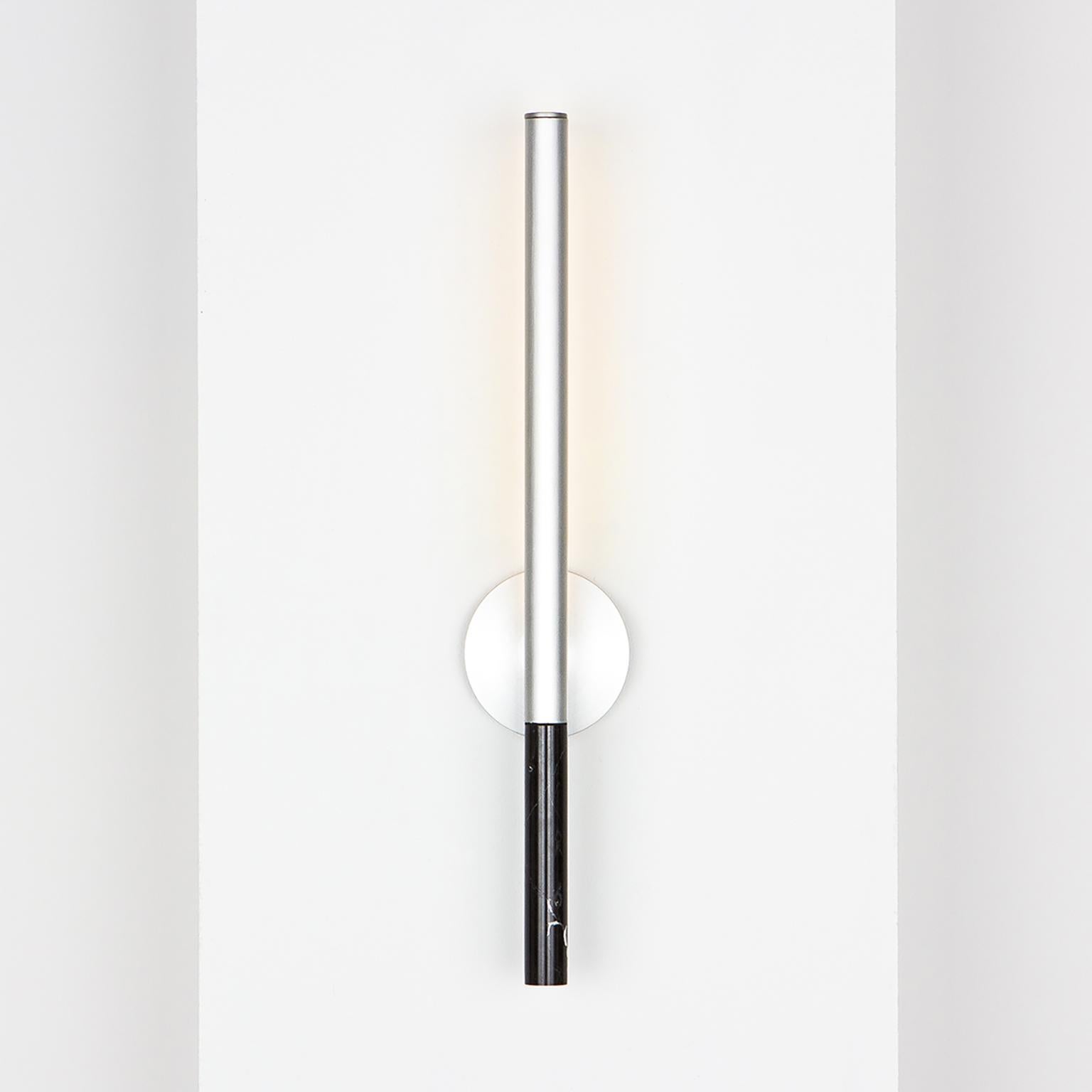 Formation wall sconce is a luxury wall mounted LED light fixture ideally suited for hallways, powder rooms and other domestic and commercial spaces that require an accent light.
The core design is a set of interlocking extruded aluminum profiles,