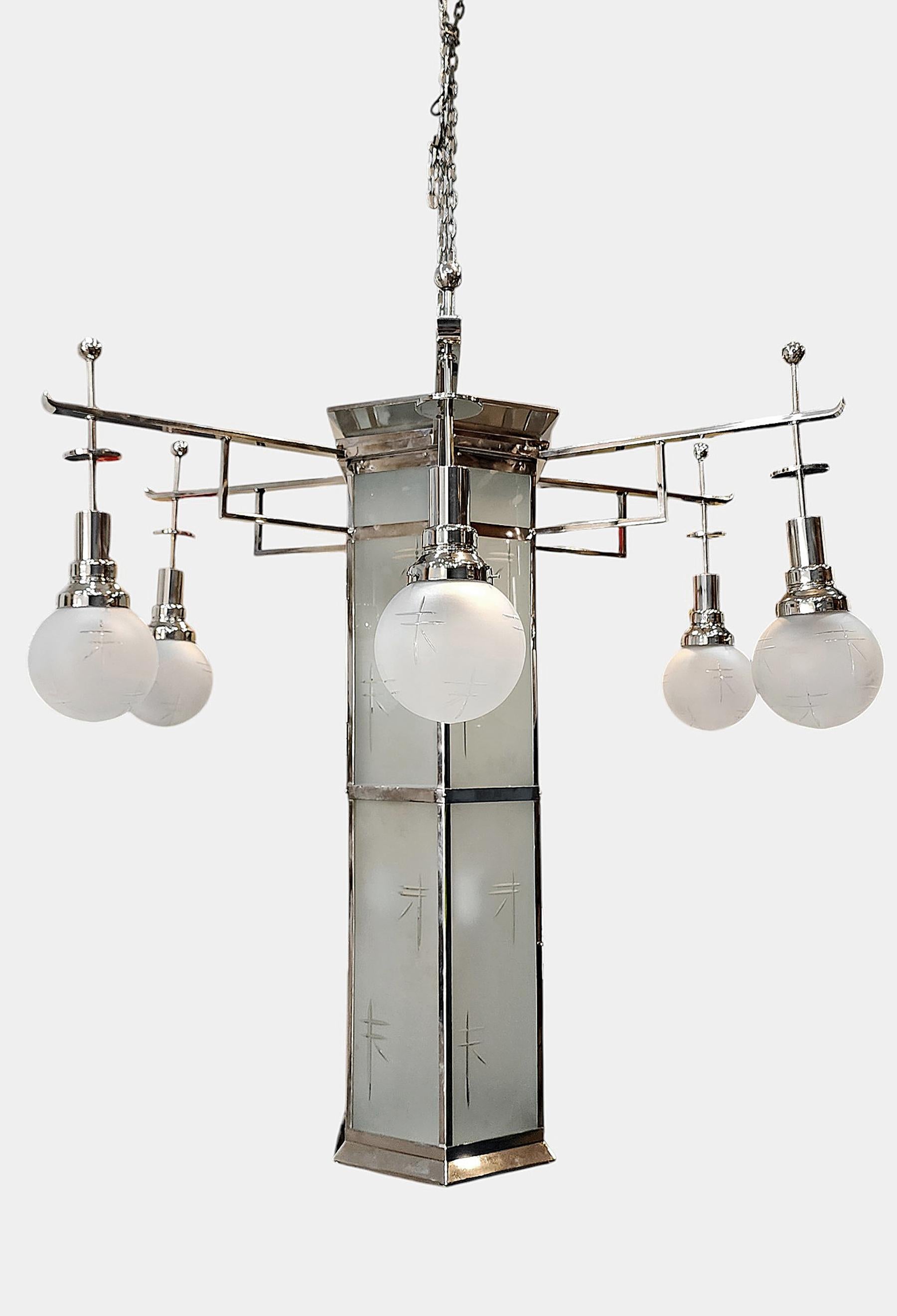 1920s former Palacio Sudamérica's Art Déco metal and glass lighting fixture, Uruguay

By: Raymond Subes (in the style of)
Material: metal, glass, crystal
Technique: cast, molded, polished, metalwork, frosted
Dimensions: 52 in x 44 in
Date: early