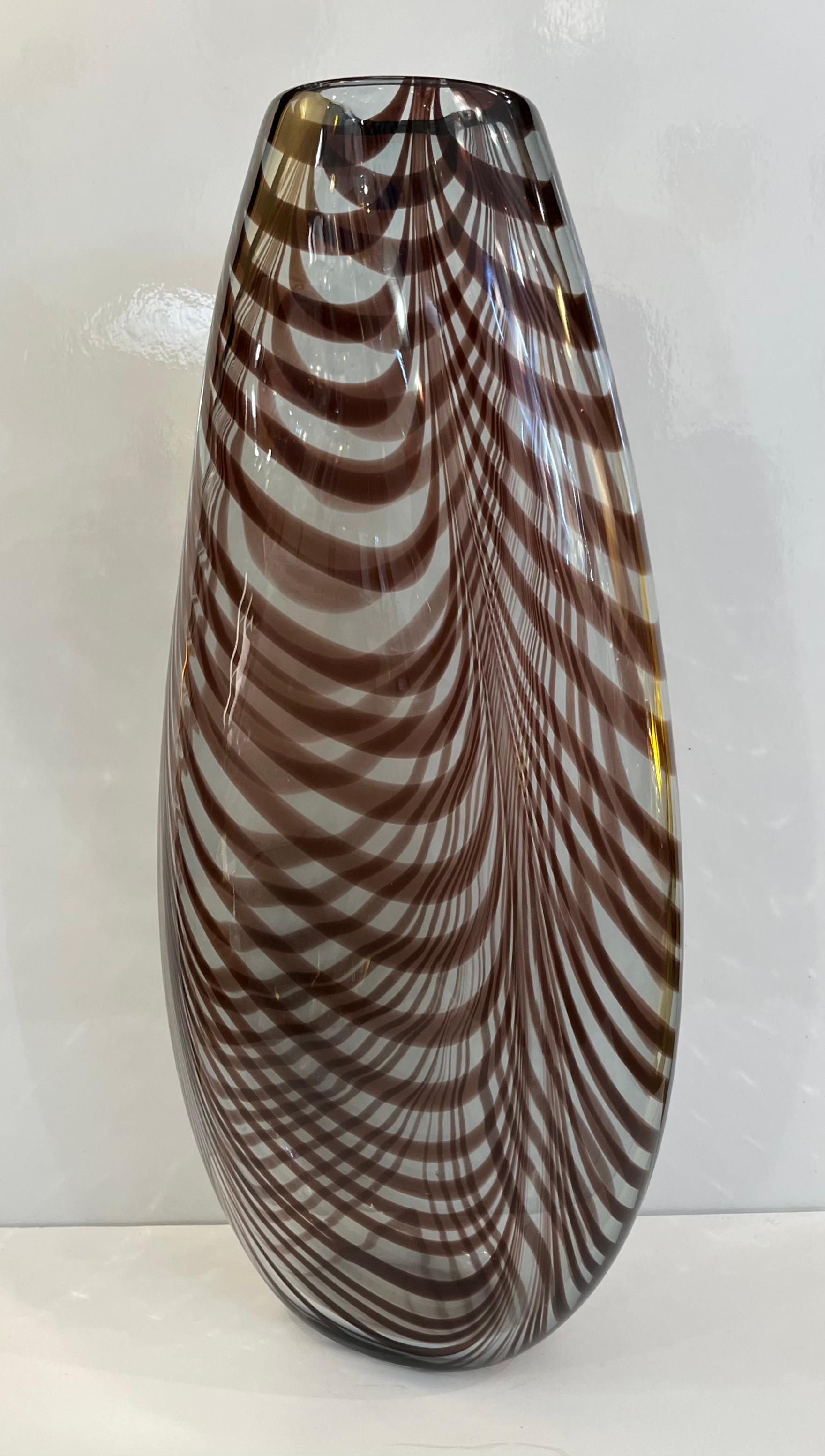 Precious vintage art sculpture vase by Formia in overlaid blown crystal clear murano glass with organic fenicio decoration in an unusual deep amethyst color. This heated decor technique consists in applying vitreous threads of murano glass to the