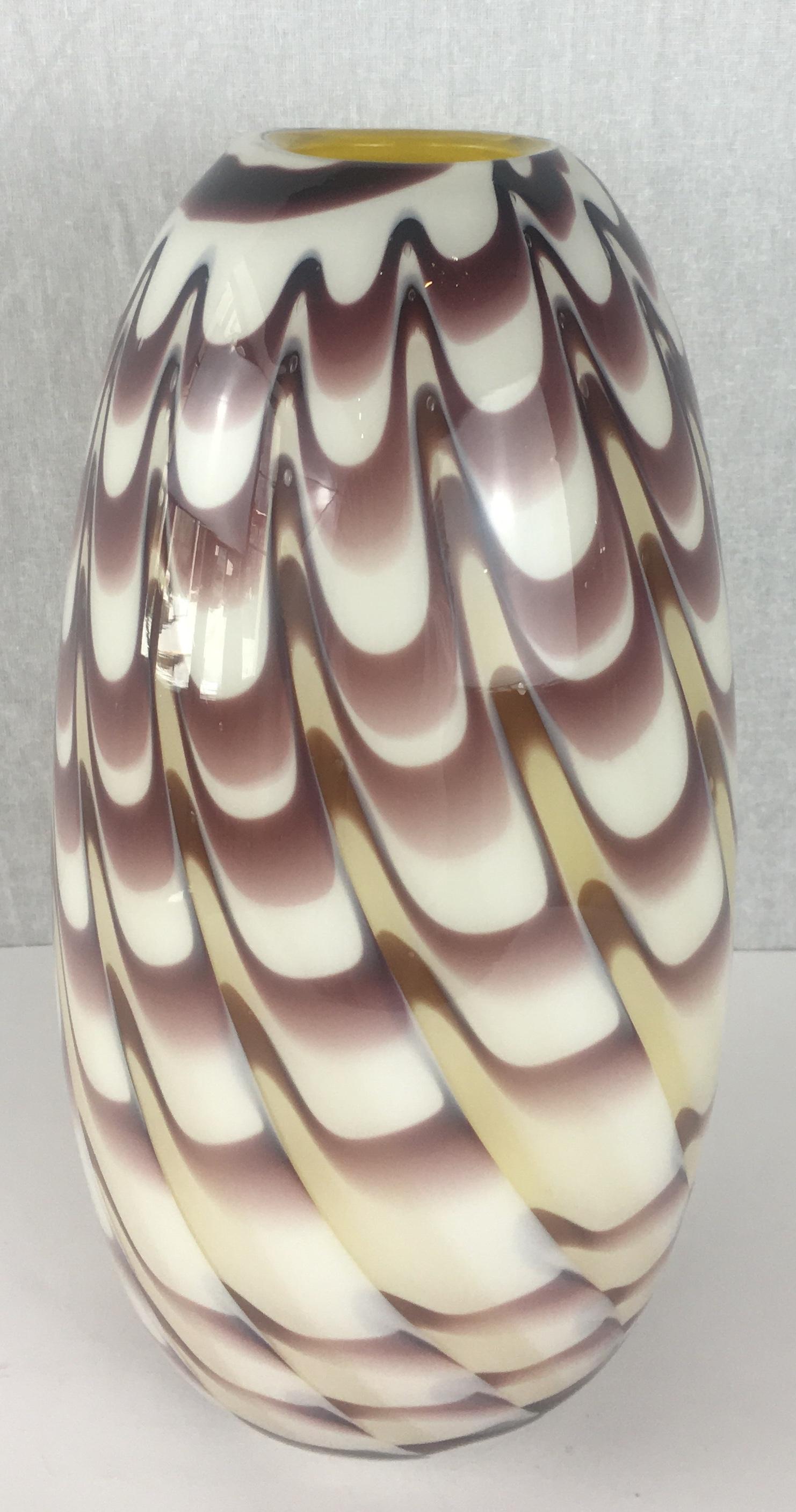 Precious vintage art sculpture vase by Formia in overlaid blown crystal clear Murano glass with organic Fenicio decoration in an unusual purple brown color with pale yellow interior. 

This heated decor technique consists in applying vitreous