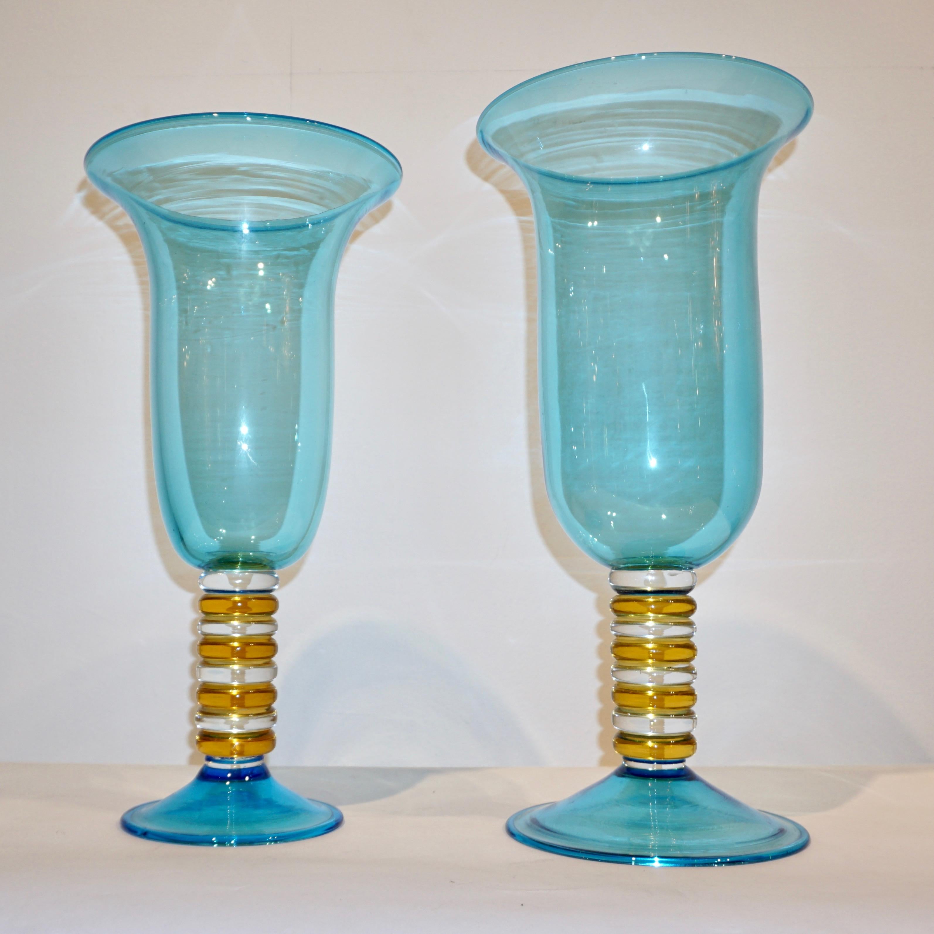 One-of-a-kind vintage mid-20th century blown Murano glass vases by Formia, superb turquoise blue color that shimmers because of the high quality craftsmanship, intensifying at the borders and multiplying light reflections, presenting an organic