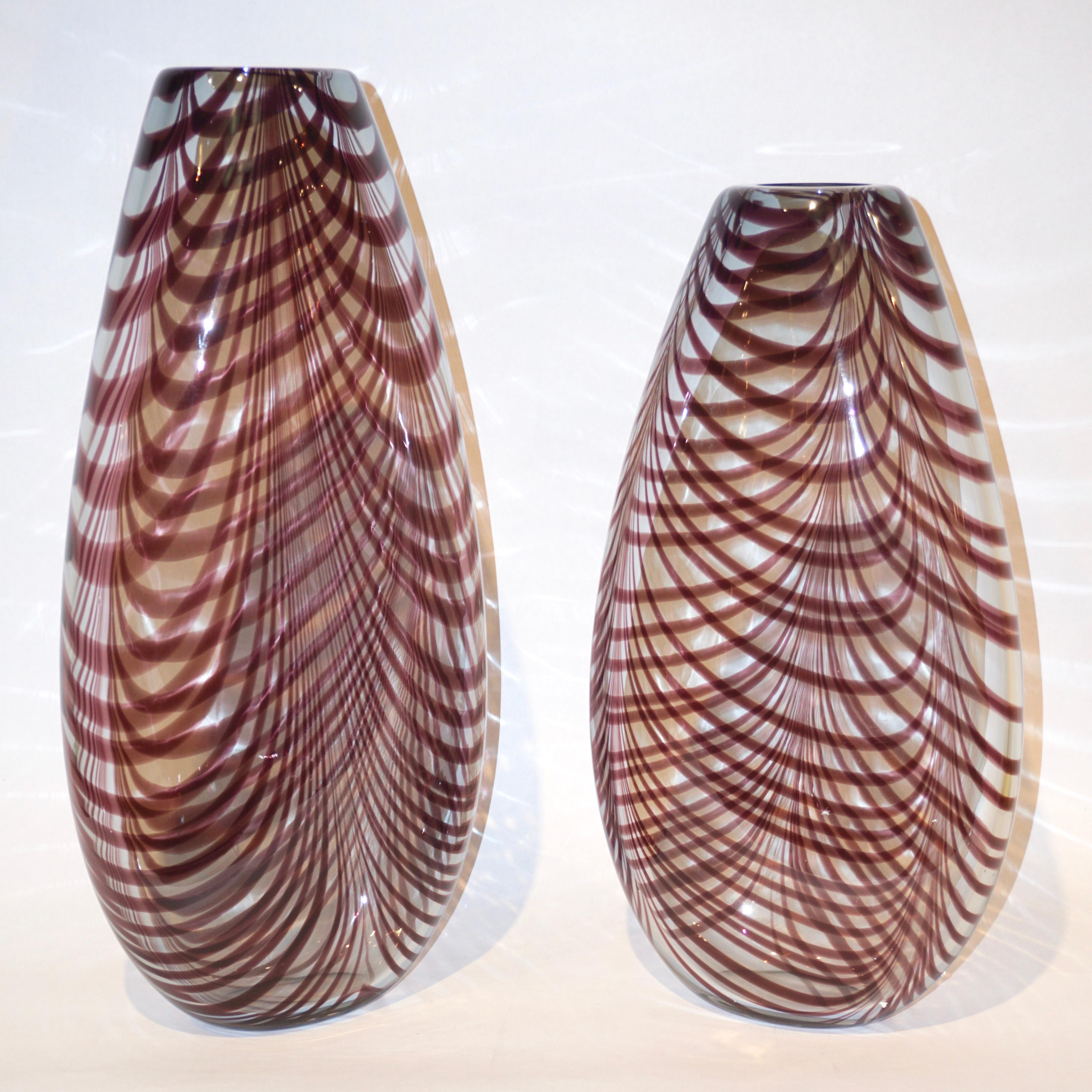 Precious vintage art sculpture vases by Formia in overlaid blown crystal clear Murano glass with organic Fenicio decoration in an unusual deep amethyst color. This heated decor technique consists in applying vitreous threads of Murano glass to the