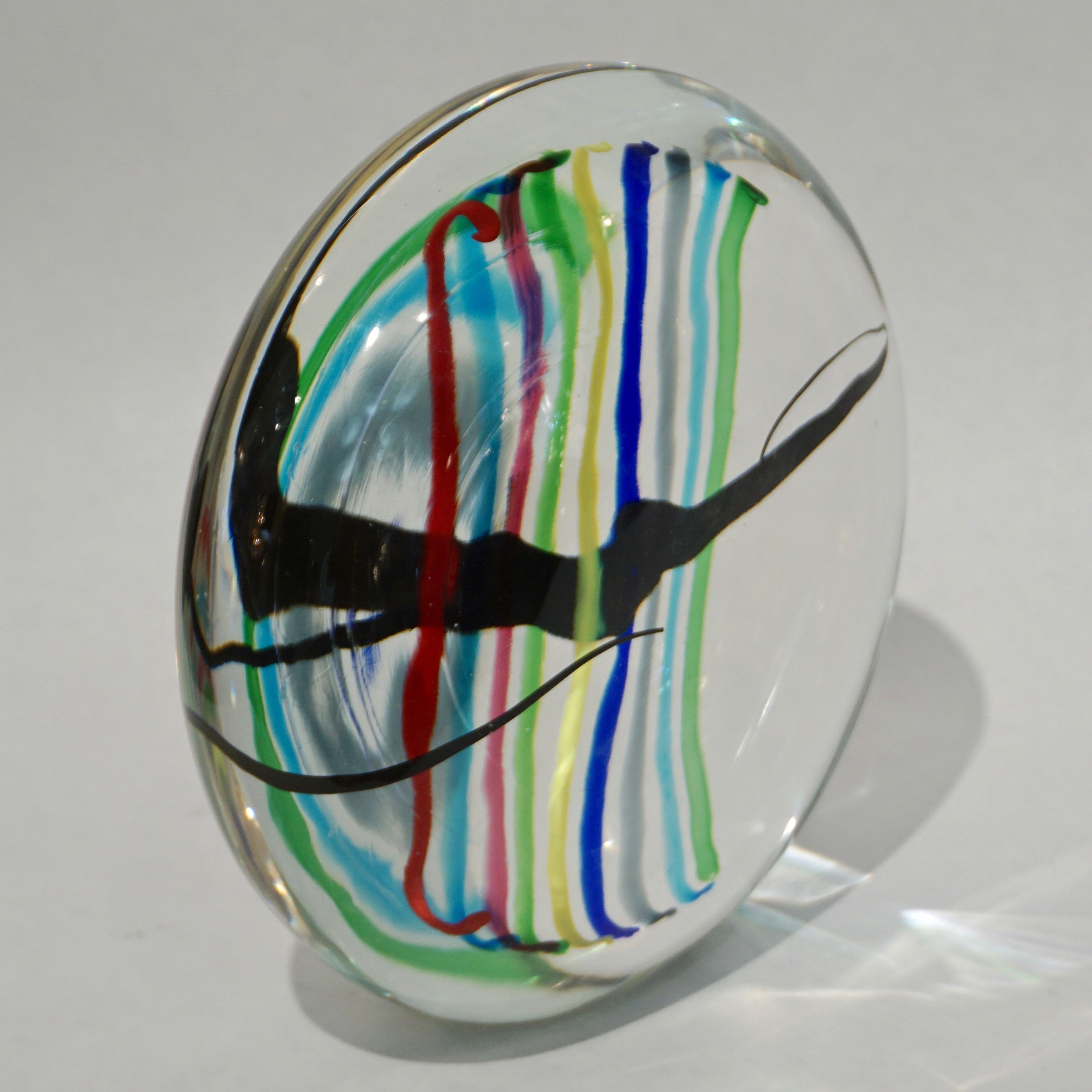 Formia 1970s vintage Italian modern design round sculpture or centerpiece, of organic shape, in blown crystal clear Venetian Murano glass decorated with rainbow stripes in red, aqua blue, pink, apple green, yellow, dark blue, grey and a freeform
