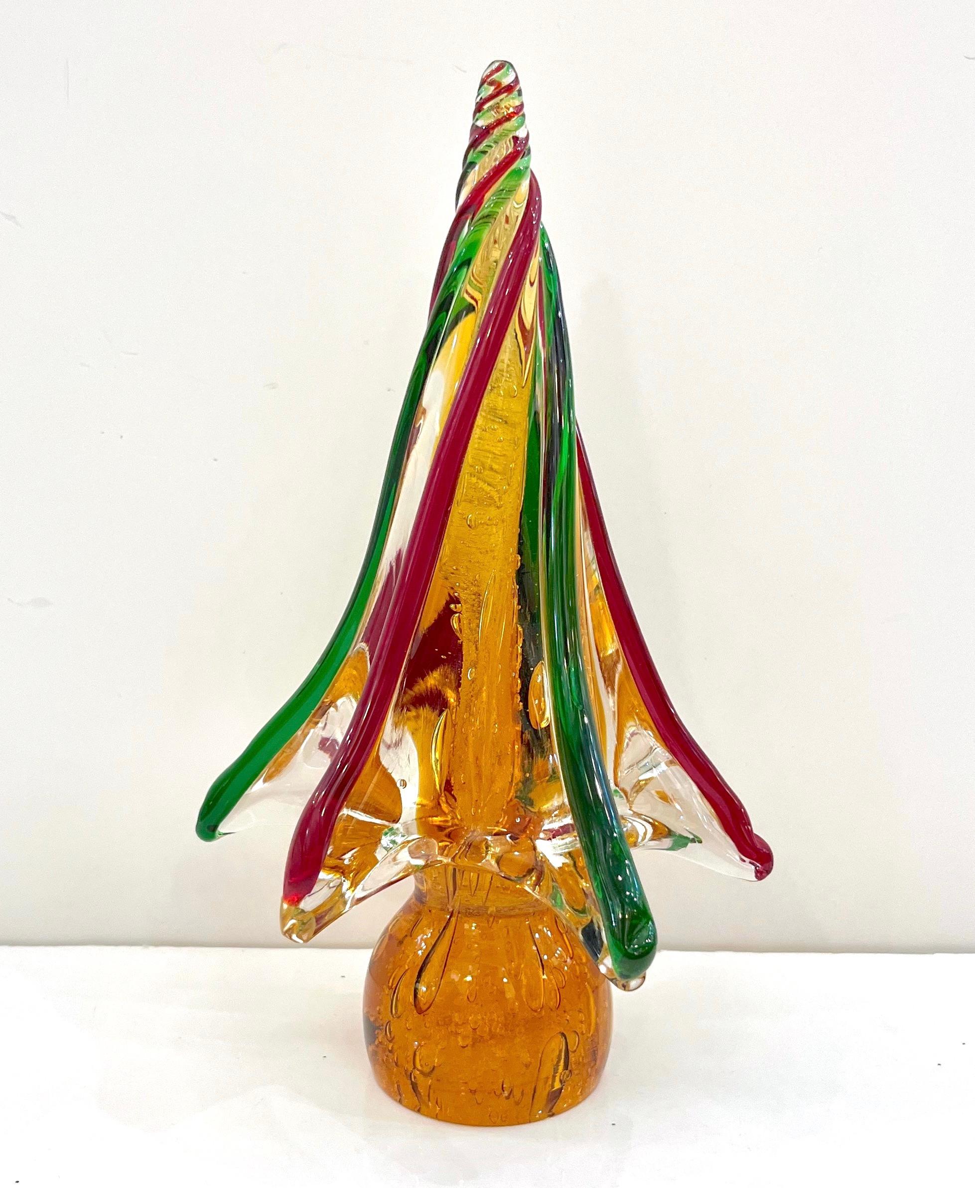 Murano glass trees of organic sleek modern design, a vintage creation by the Venetian company Formia, signed pieces, individually mouth blown and handcrafted. Made precious by the use of the Pulegoso technique in a core of amber color and