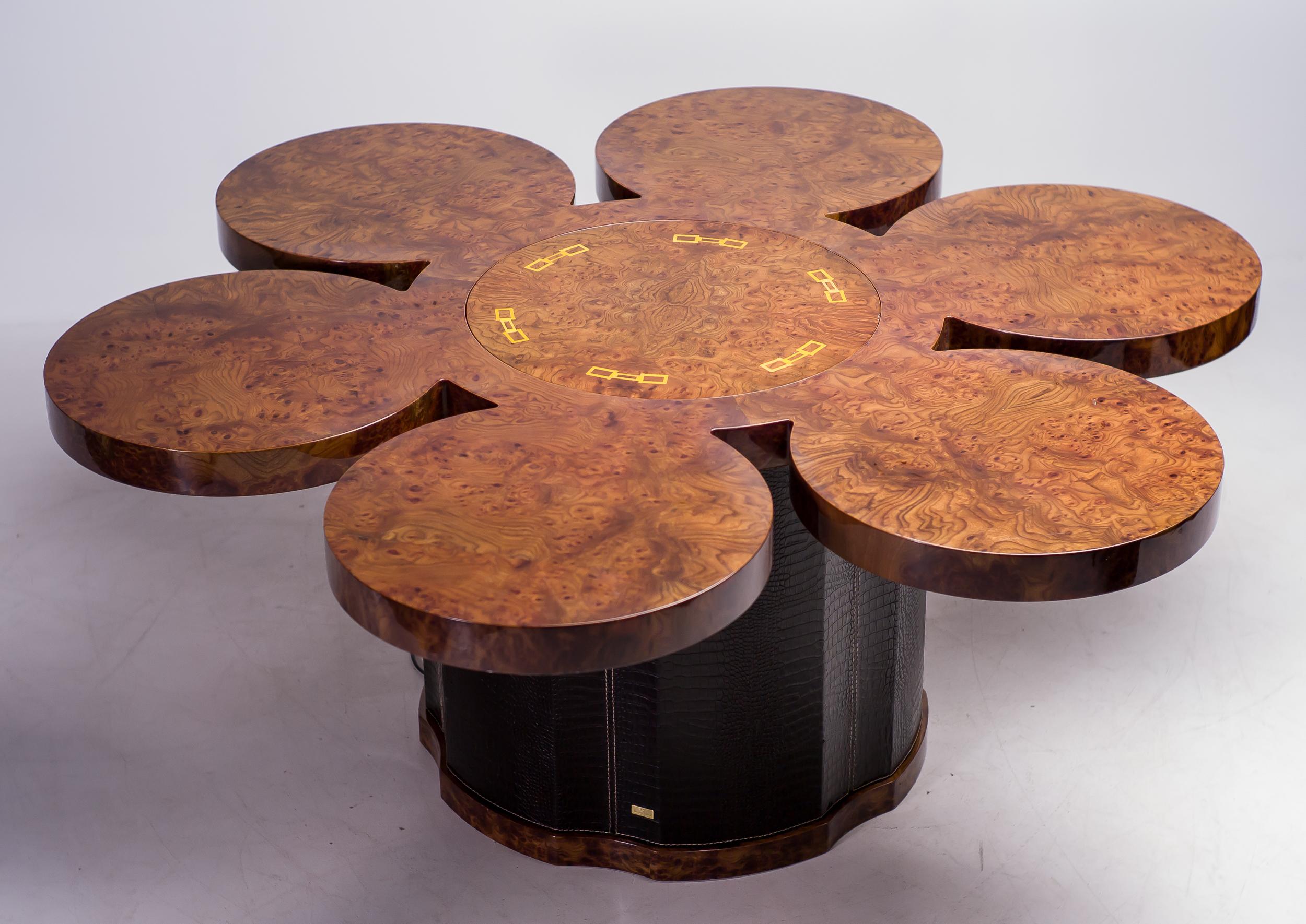 One-off dining table by luxury Italian design label Formitalia, with built-in electrical bar lift.
Leather clad base, burl walnut veneered top with yellow inserts. Formitalia is renowned from their collaborations with Aston Martin and