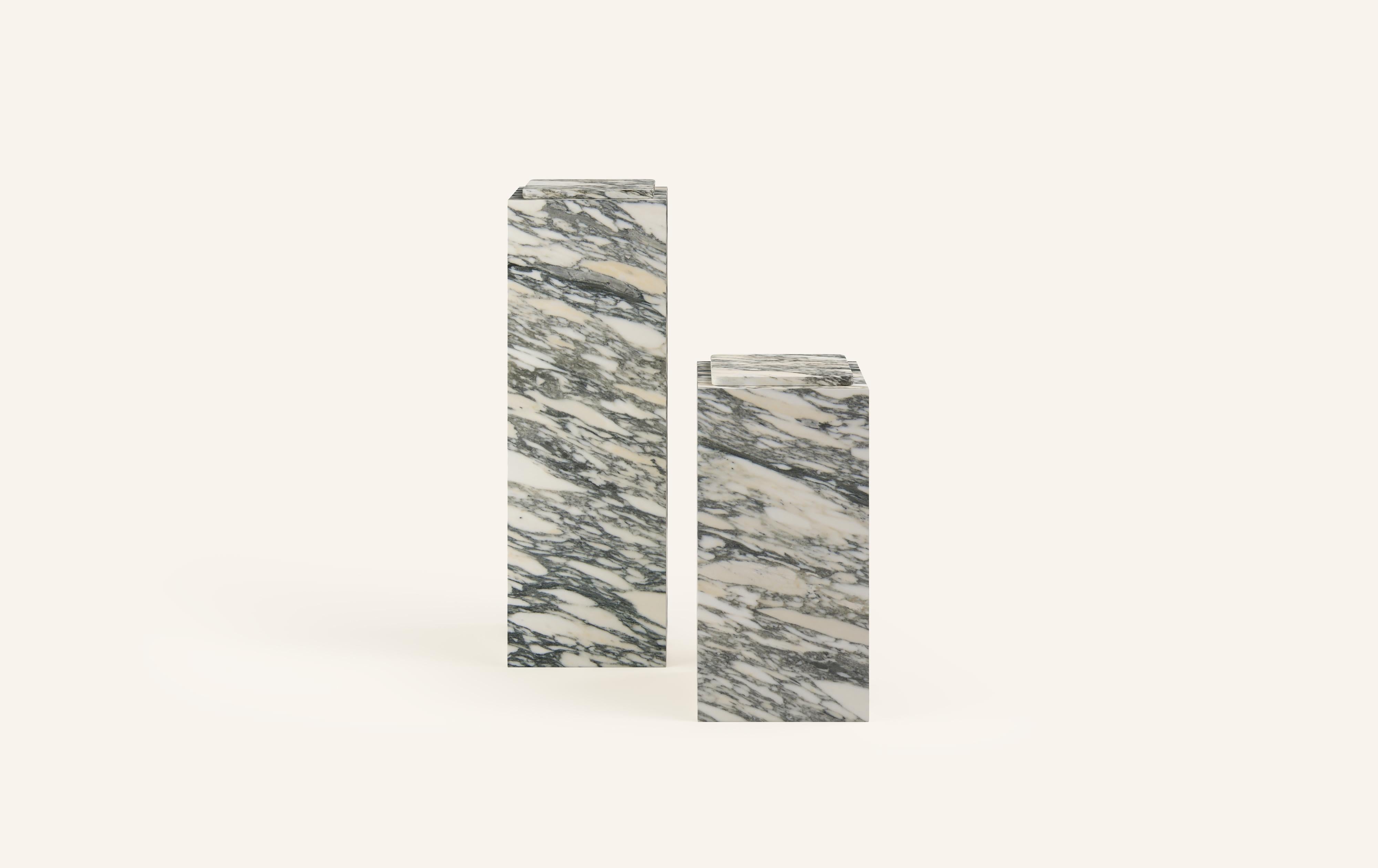 MONOLITHIC FORMS SOFTENED BY GENTLE EDGES. WITH ITS BOLD MARBLE PATTERNS CUBO IS AS VERSATILE AS IT IS STRIKING.

DIMENSIONS (PEDESTALS SOLD INDIVIDUALLY):
12”L x 12”W x 24”H: 
- 3/4